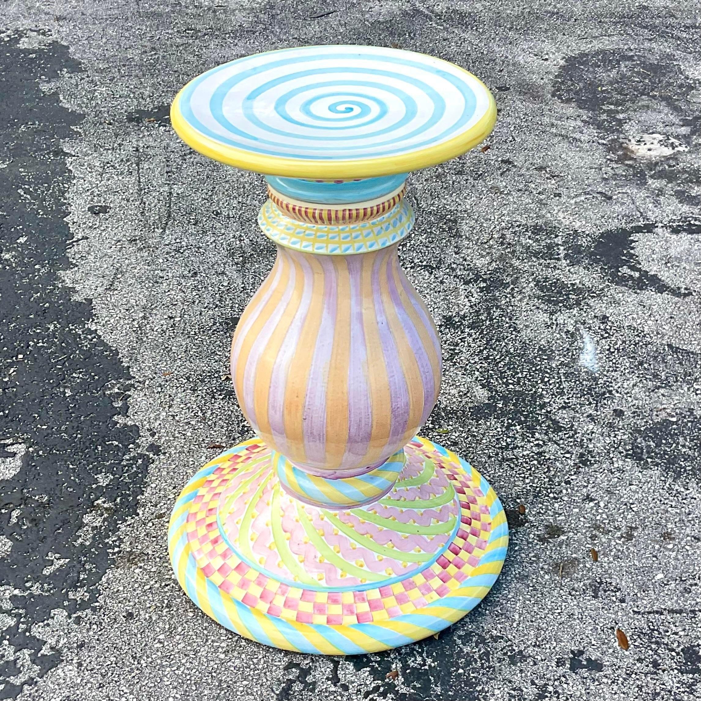 A fabulous vintage Boho hand painted dining table. A chic terracotta pedestal in a colorful glazed ceramic finish. Done in the manner of Mackenzie Childs. Acquired from a Palm Beach estate. 
