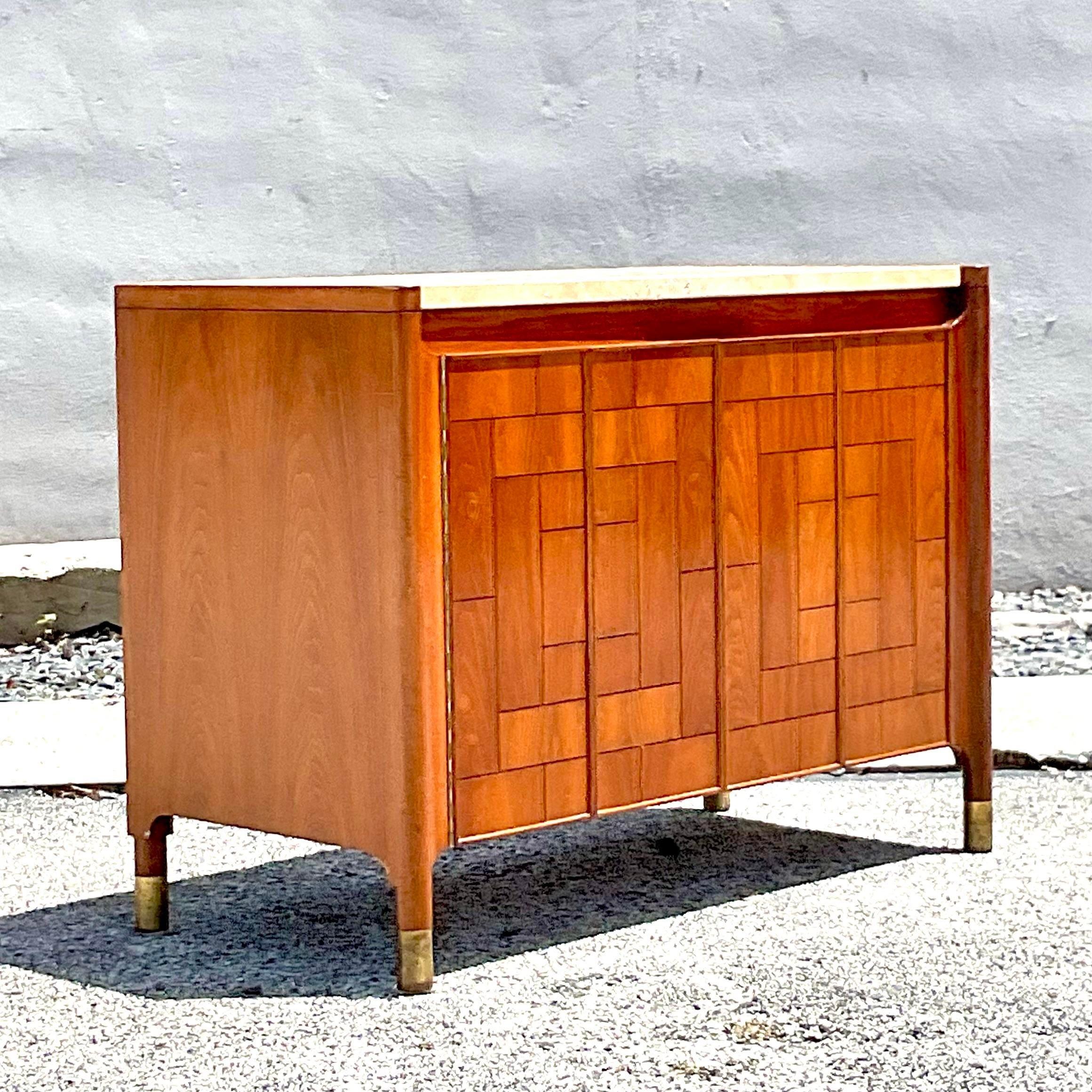 A fabulous vintage Boho sideboard. Made by the iconic Drexel Heritage group. Marked on the inside. chic travertine top and a fabulous patchwork design. Acquired from a Palm Beach estate.