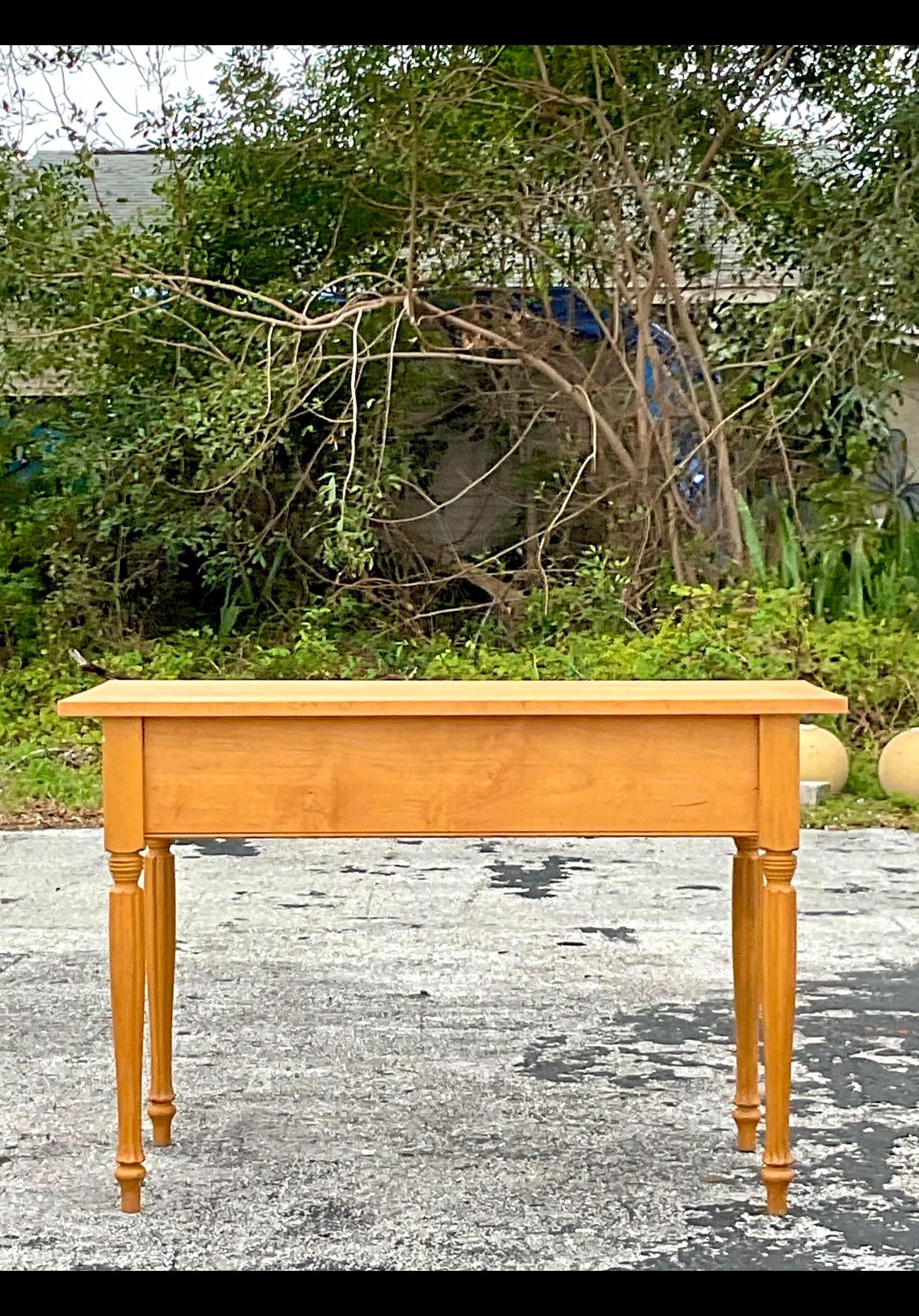 A fabulous vintage Boho console table. A chic farm table look in a gorgeous pale maple. Perfect as a console, but would also be a gorgeous center island in a kitchen. Just add a piece of marble for a great pastry table. You decide! Acquired from a