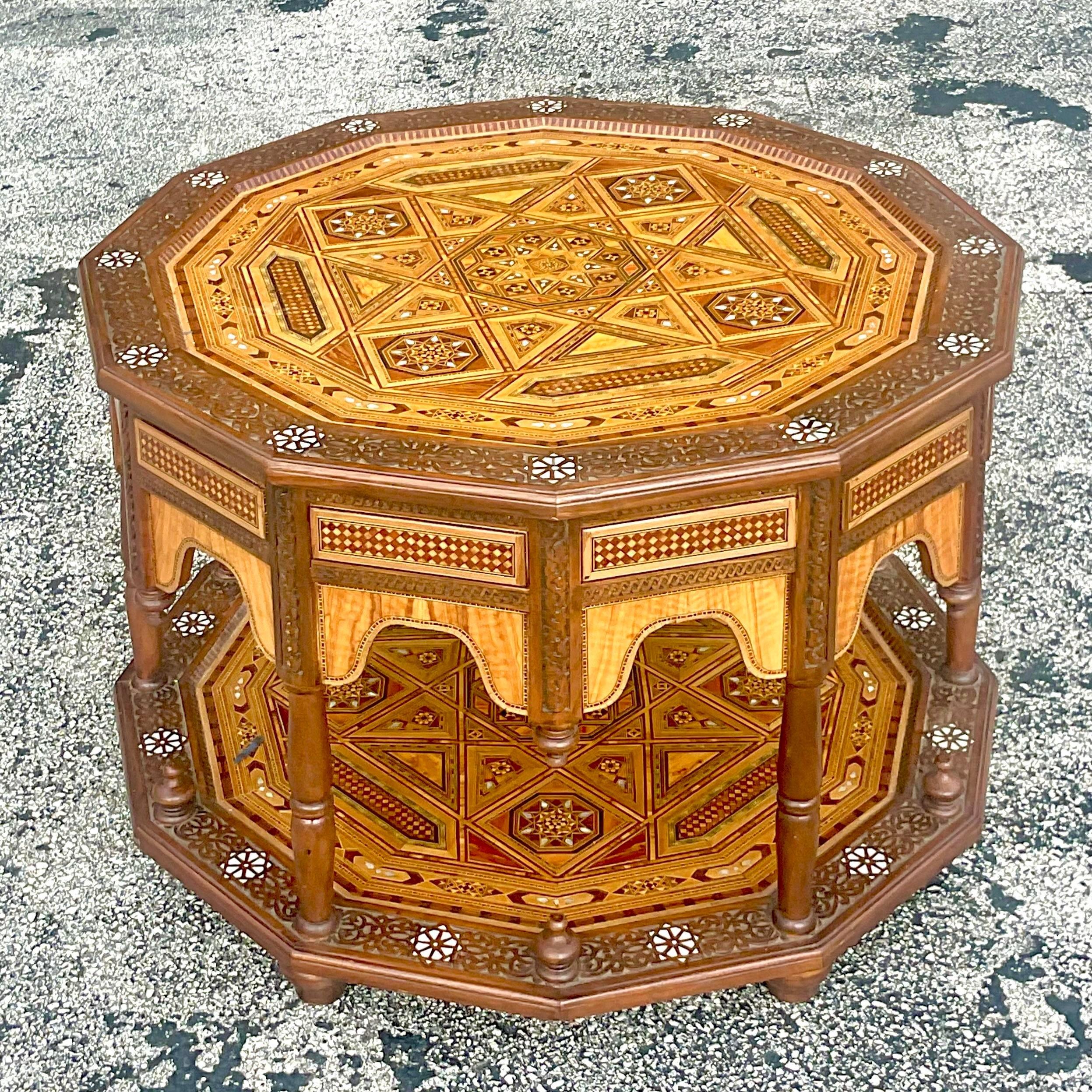 An extraordinary vintage Boho coffee table. A chic Moroccan style with incredible inlay detail. Acquired from a Palm Beach estate.
