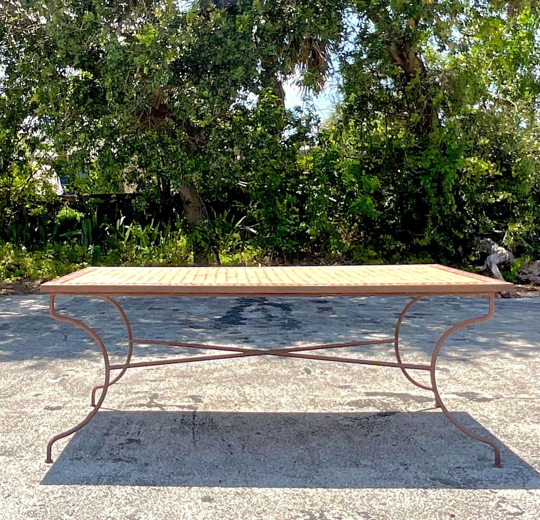 Add an eclectic touch to your dining space with this Vintage Boho Moroccan Tile Dining Table. Featuring vibrant hand-painted tiles and a sturdy design, this table blends exotic Moroccan artistry with laid-back American boho style, creating a unique