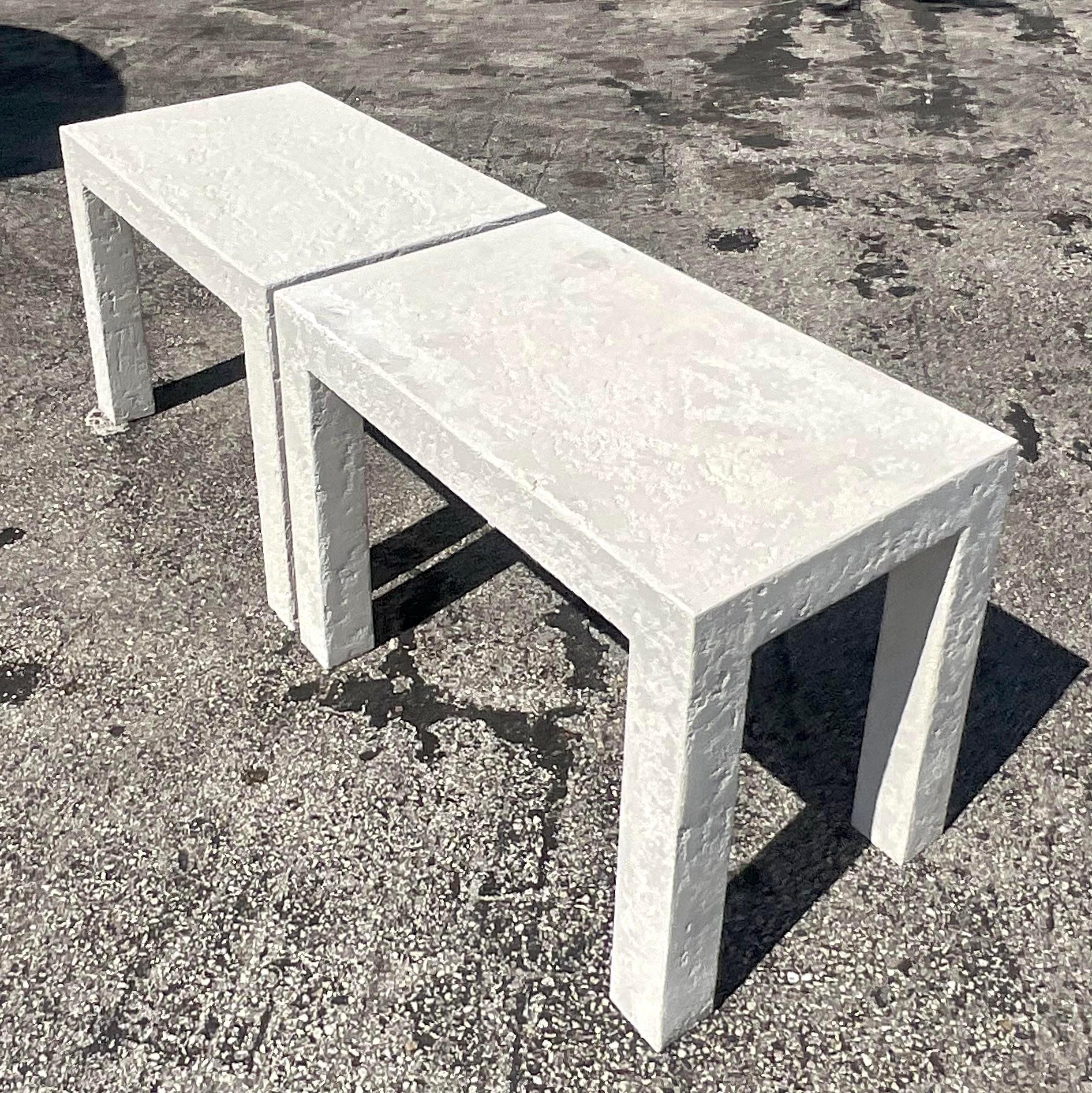 Elevate your living space with a touch of bohemian charm through this pair of Vintage Boho Plaster Side Tables. Each table boasts unique textures and earthy tones, embodying the free-spirited essence of American style. Crafted with meticulous