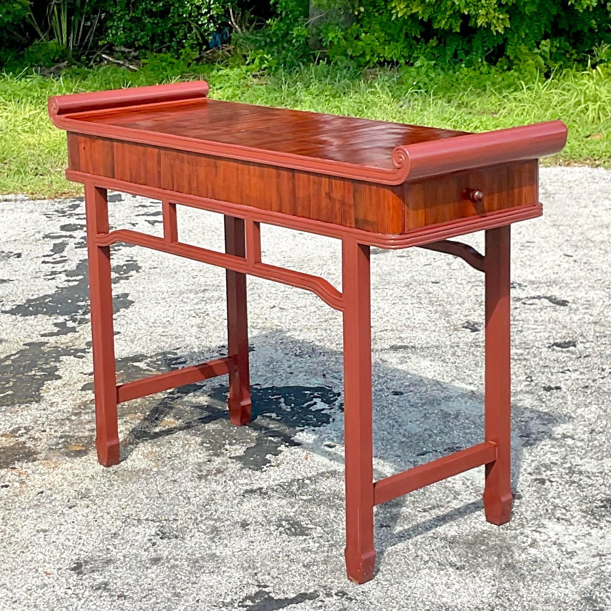 A fabulous vintage Boho console table. A chic Pagoda style with a reclaimed wood frame. A deep wine color in a gloss finish. Taller than usual for extra drama. Acquired from a Palm Beach estate.