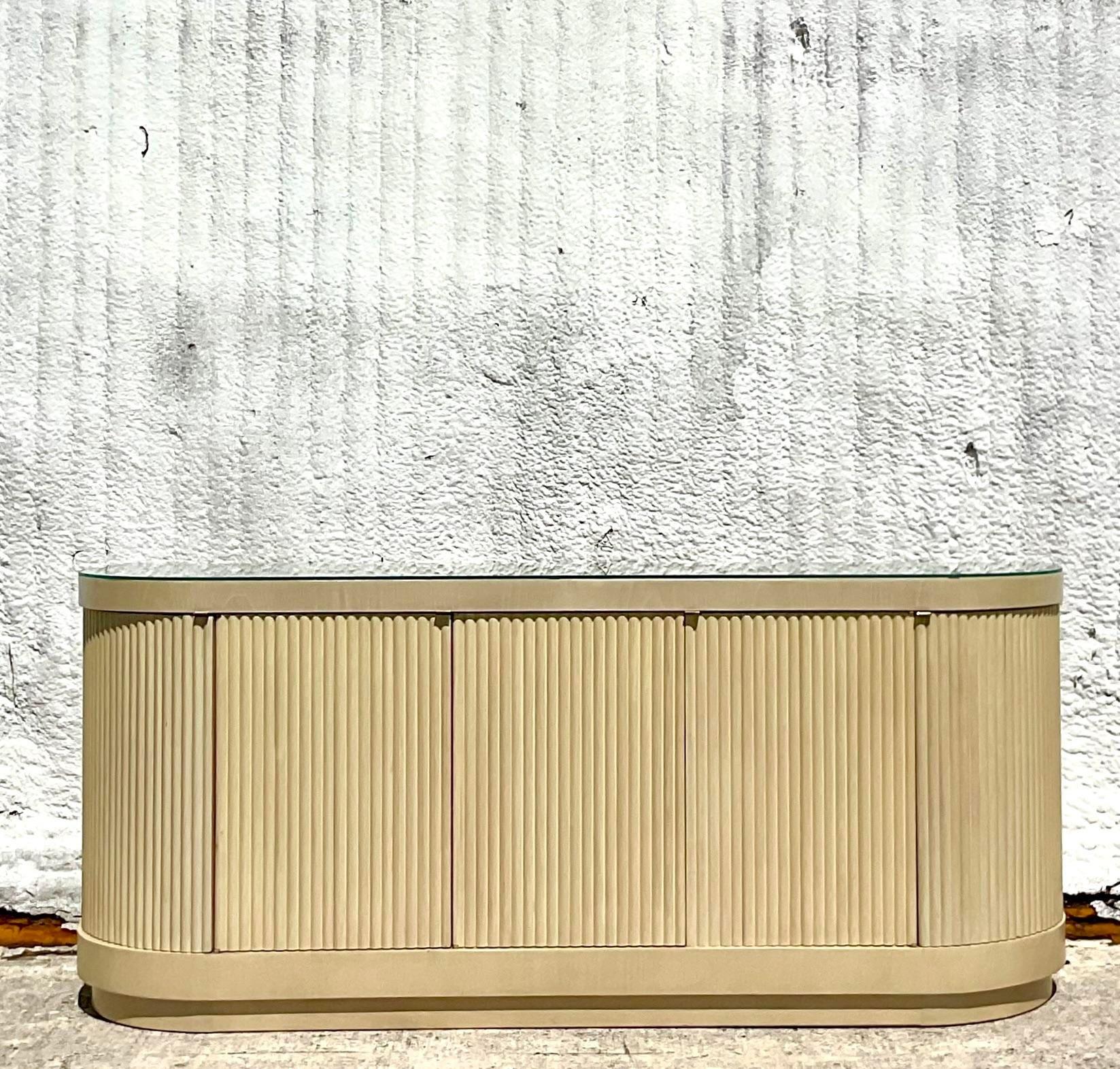 A stunning vintage Boho curved credenza. Made by the iconic Romweber group. A chic ribbed design in a pale cerused finish. Tagged inside the drawer. Acquired from a Palm Beach estate.