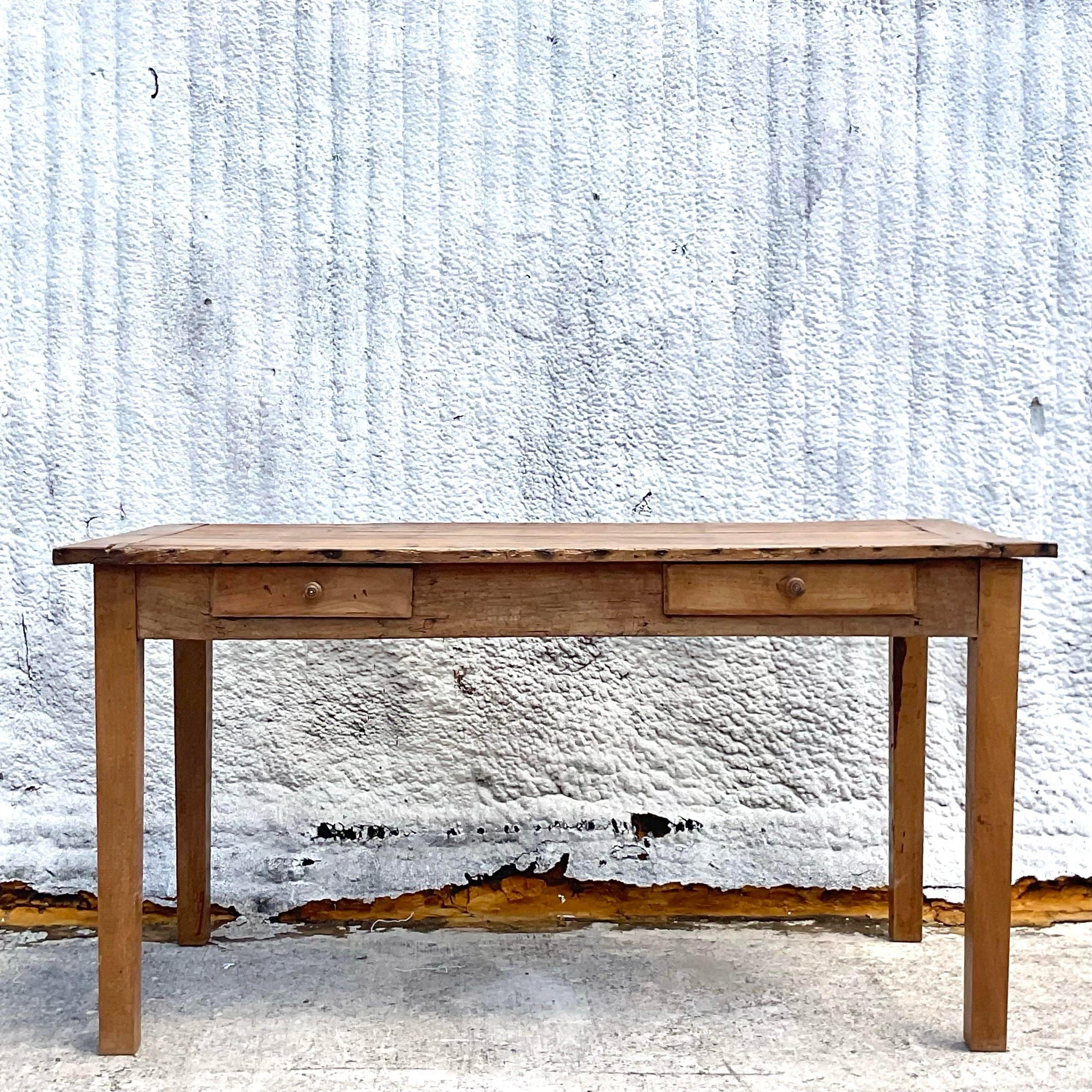 A fabulous vintage Boho dining table. A gorgeous rustic finish with a gorgeous patina from time. Slightly smaller so it’s perfect for a space challenged room. Would also be a great desk, kitchen island or library table. Acquired from a Palm Beach