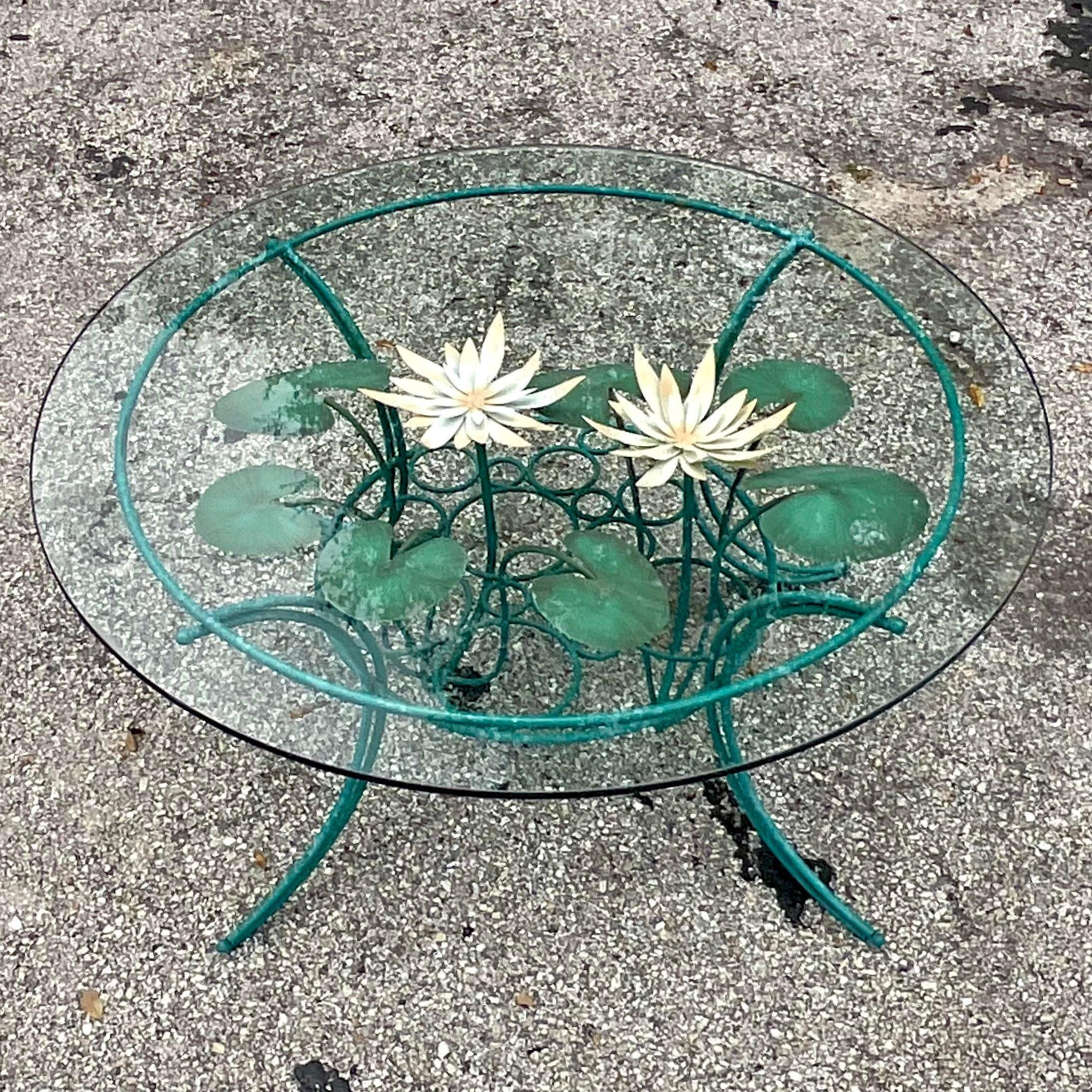 A fabulous vintage Boho Painted metal coffee table. Done by the iconic Curtis Jere and signed on the frame. Beautiful lily pad design with a chic floral motif. Acquired from a Palm Beach estate.