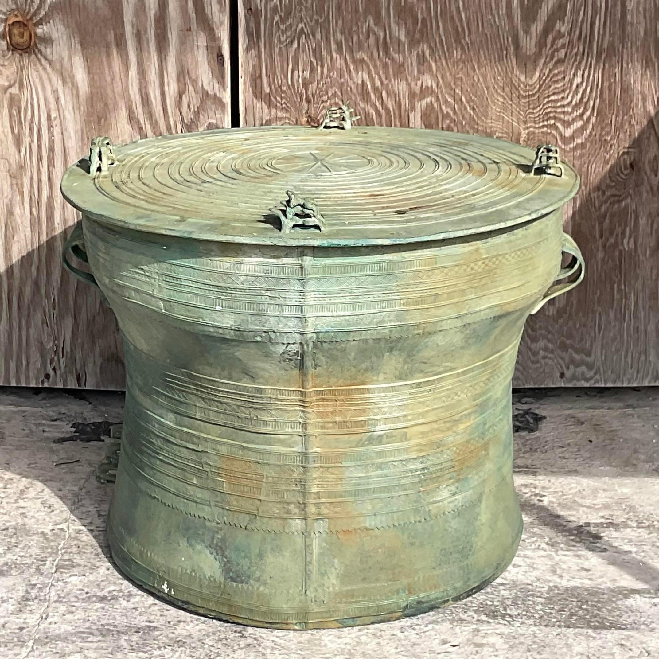 A fantastic vintage Boho side table. A chic bronze drum table with lots of beautiful detail. A fantastic all over patina from time. Acquired from a Palm Beach estate. 