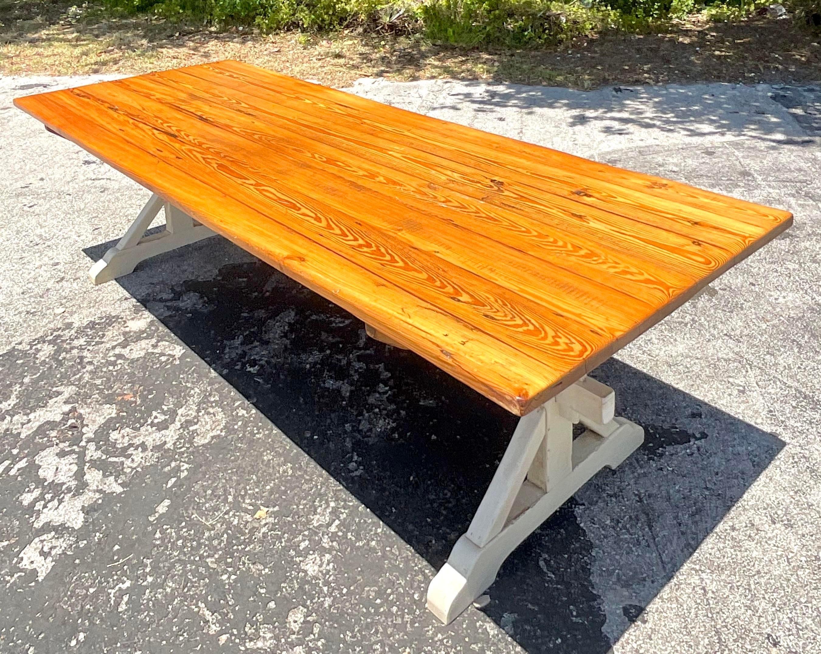 Experience the warmth of farmhouse hospitality with our Vintage Boho Trestle Plank Farm Table. Inspired by American craftsmanship and infused with Bohemian flair, this table offers both rustic charm and versatile functionality, perfect for gathering