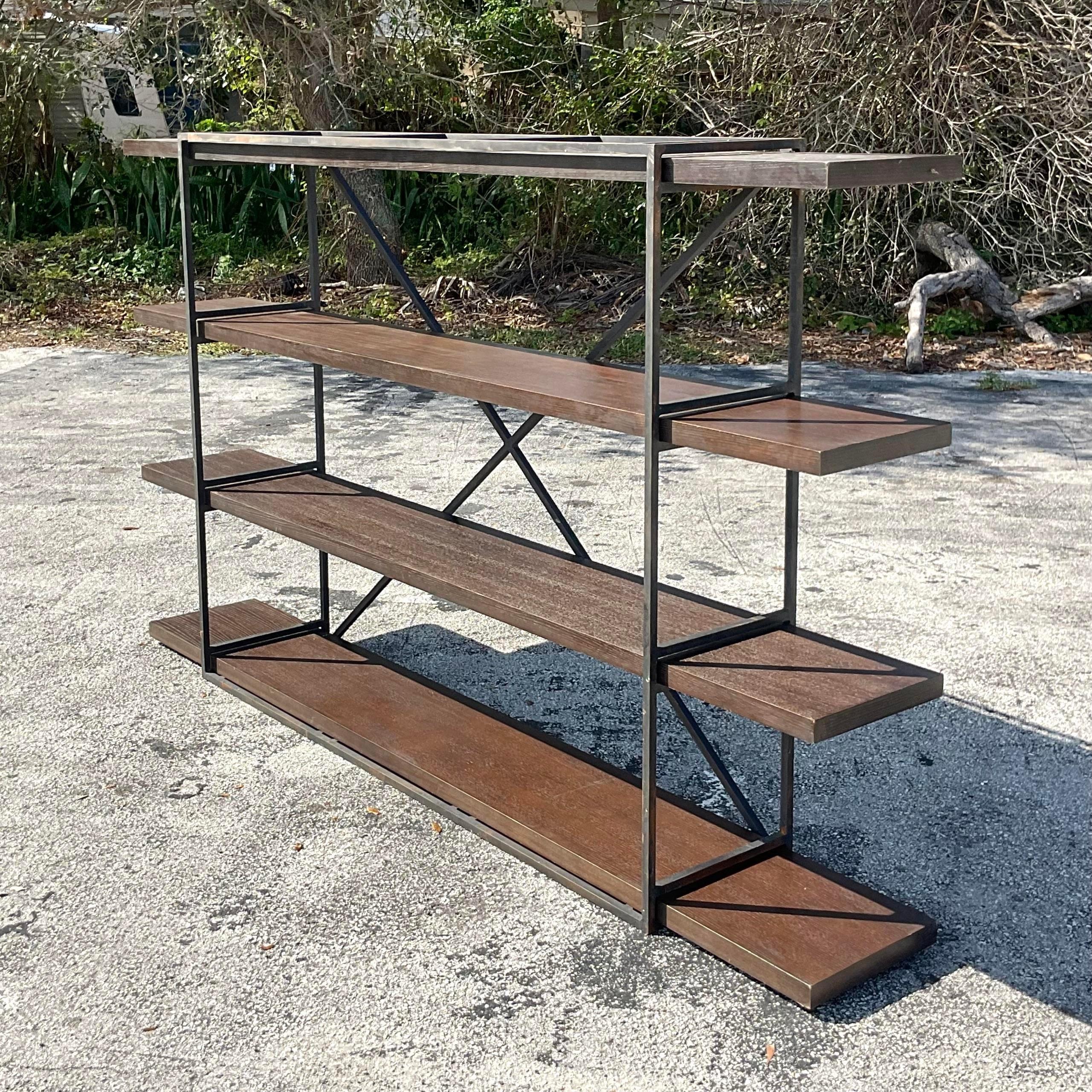 Vintage Boho Wrought Iron and Wood Plank Etagere infuses a touch of Americana into your living space. With its rugged yet refined design, this piece combines the durability of wrought iron with the warmth of wood, creating a versatile storage