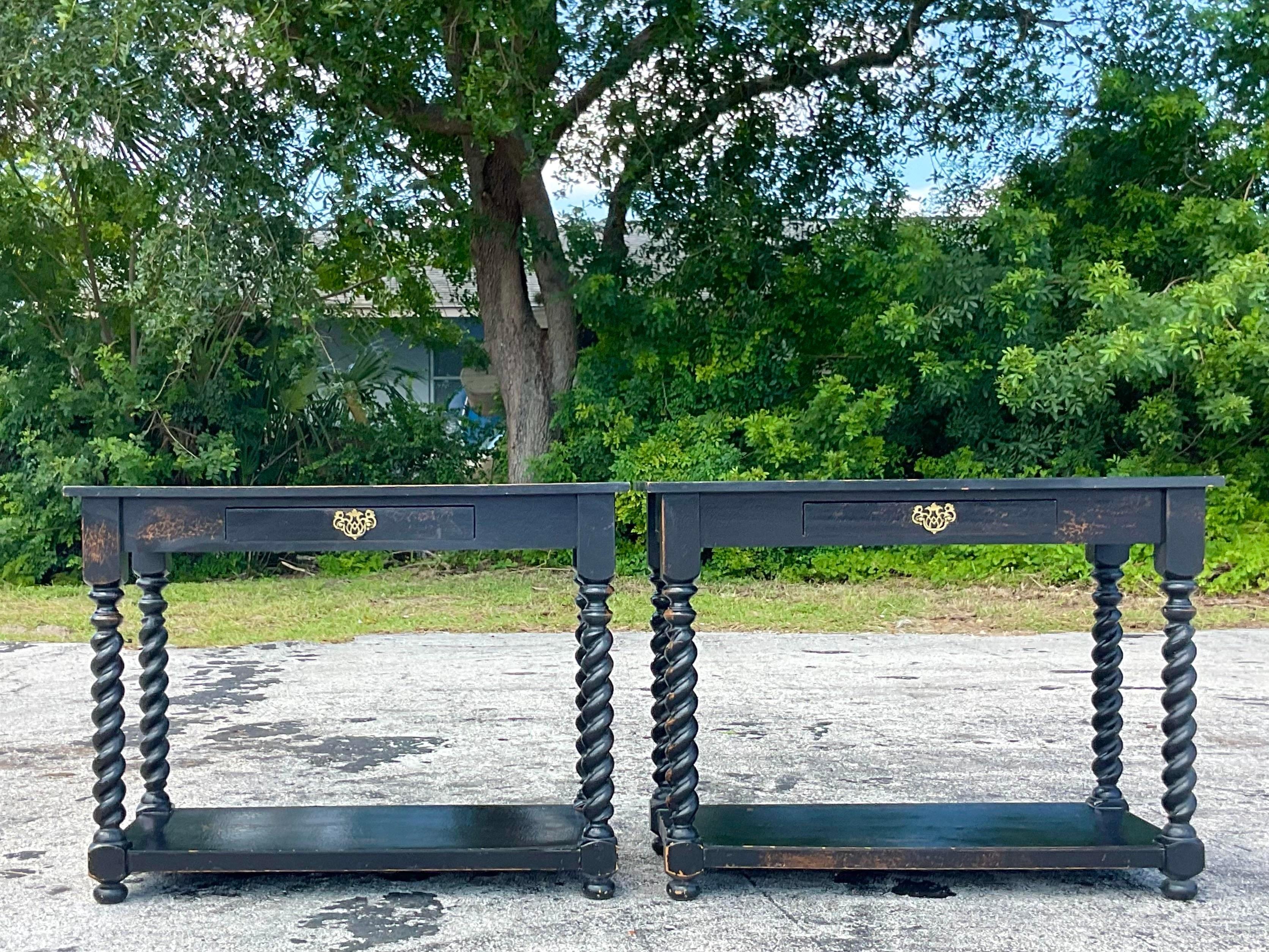 A fabulous pair of vintage Boho side tables. Made by the custom group British Traditions. Beautiful Barley Twist design with a chic black crackle finish. Tagged on the inside drawer. Acquired from a Palm Beach estate.