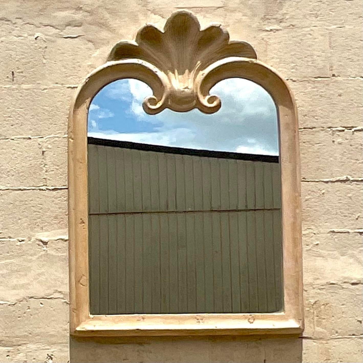 A fabulous vintage Coastal wall mirror. A chic cast plaster over wood in a clam shell design. Monumental in size and drama. Acquired from a Palm Beach estate.
