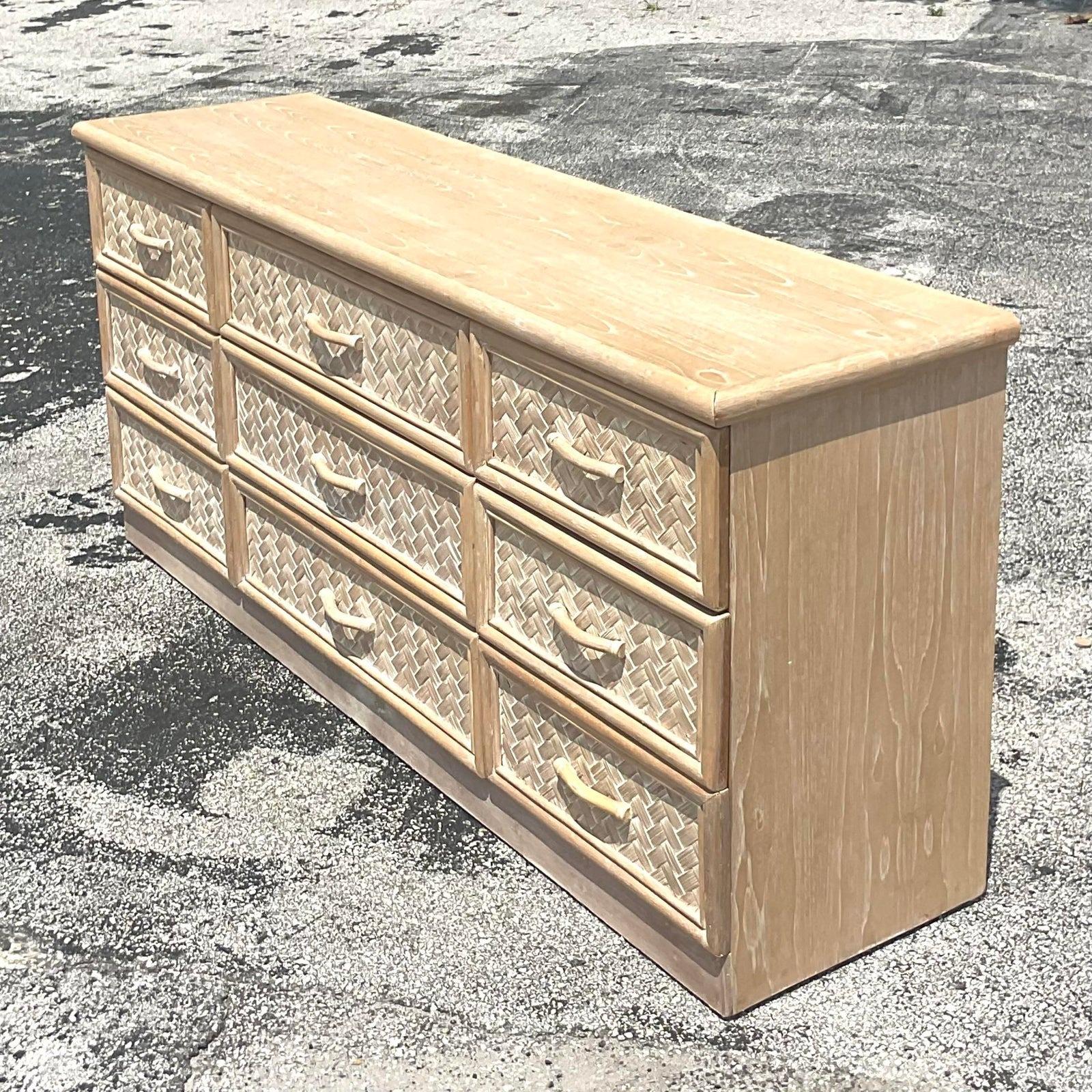 A fabulous vintage Coastal dresser. A chic cerused wood cabinet with parquet rattan drawer fronts. Acquired from a Palm Beach estate. 
