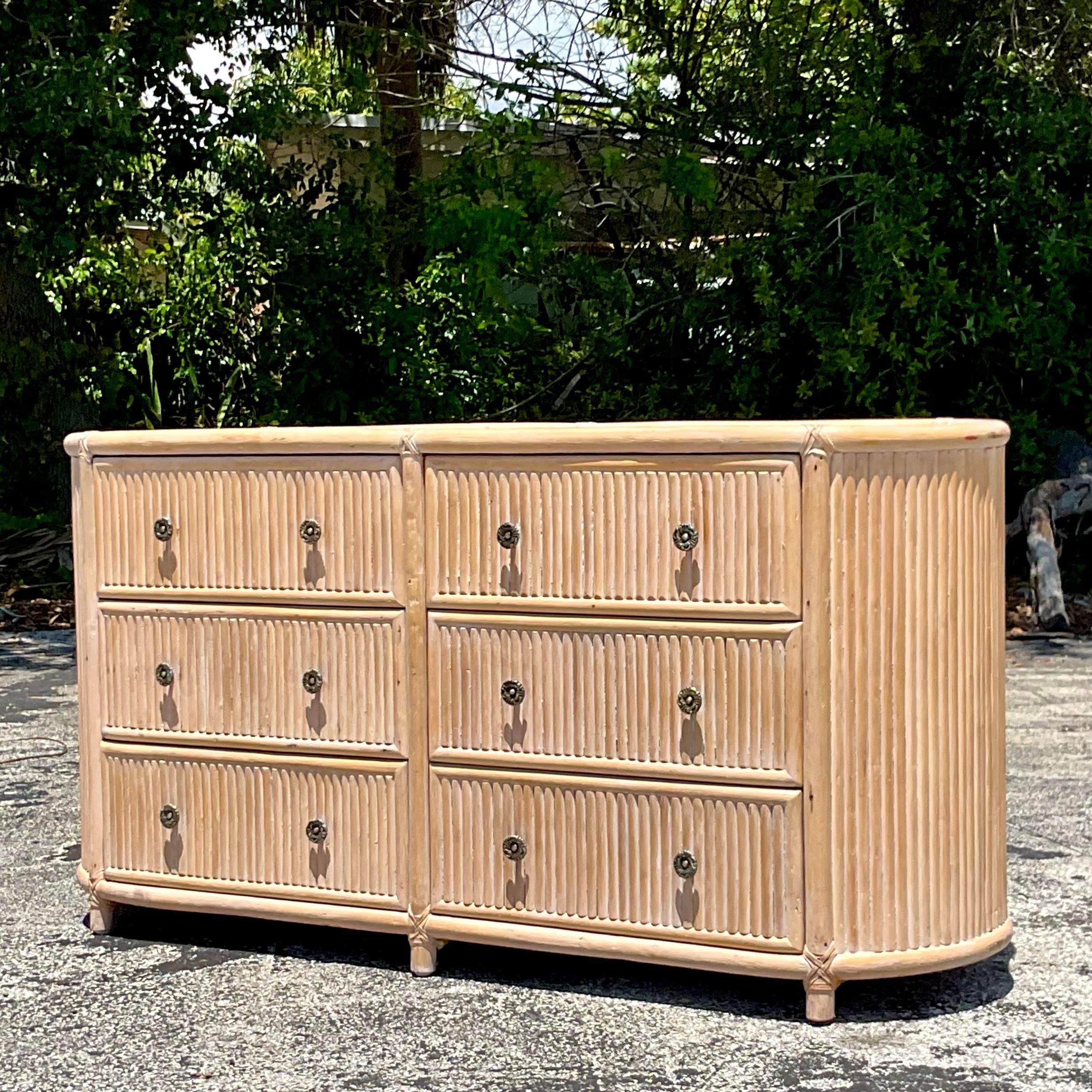 An exceptional vintage Coastal six drawer dresser. A chic elliptical shape with a Chevron pattern top. Acquired from a Palm Beach estate.