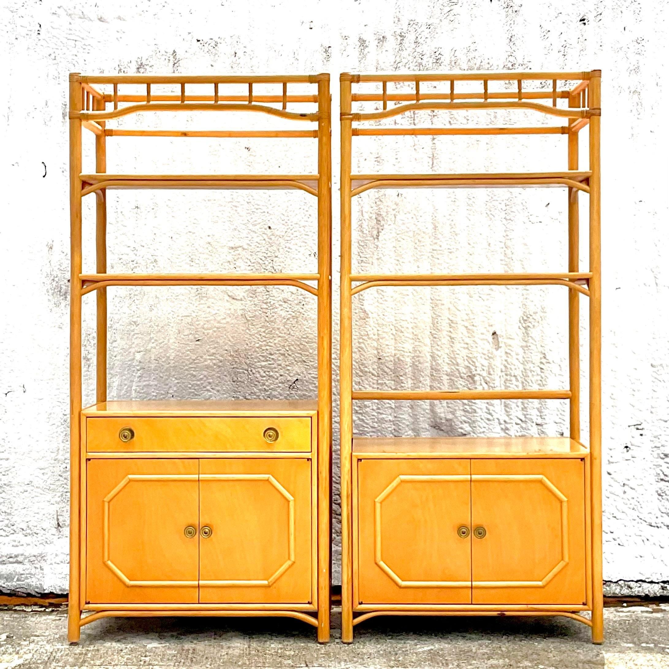 A fabulous set of 2 vintage Costal Etagere. Made by the iconic Ficks Reed group. Beautiful wood and rattan cabinet with inset glass shelves. Lots of great storage below. Acquired from a Palm Beach estate.