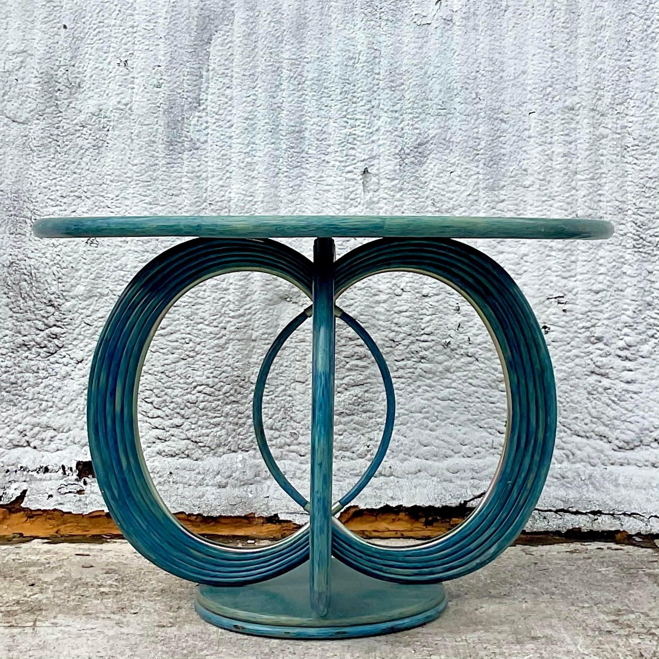 A fantastic vintage Coastal French center hall table. A chic bent rattan in a brilliant turquoise finish. A real show stopper. Acquired from a Palm Beach estate