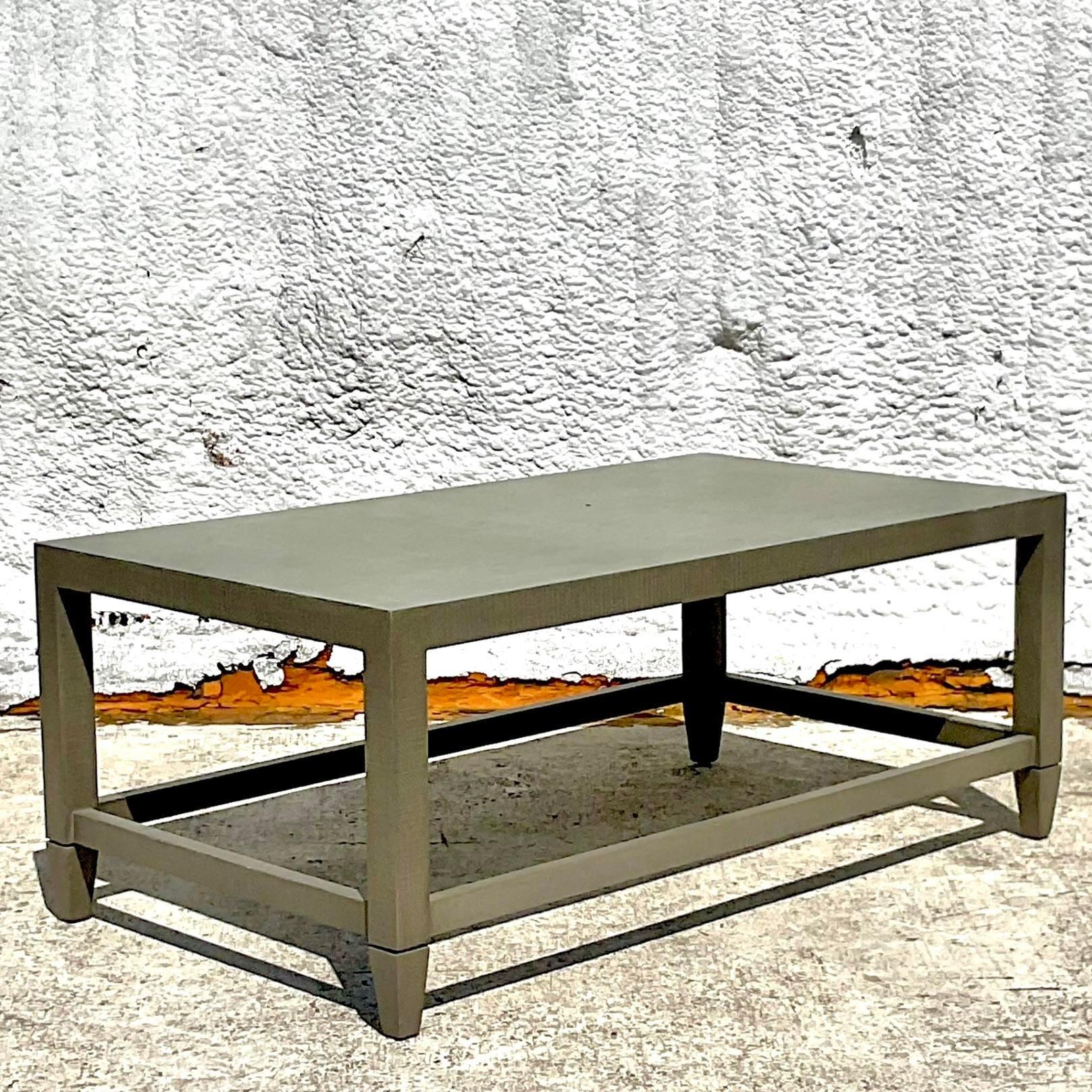 A super chic vintage Coastal coffee table. A beautiful sage green Grasscloth on a clean and classic shape. Acquired from a Palm Beach estate.