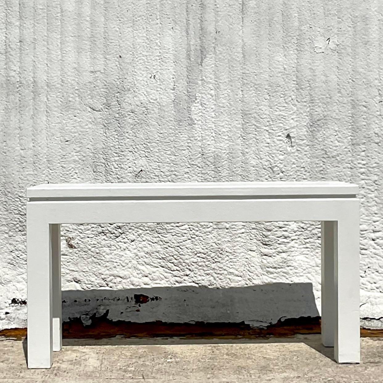 grasscloth wrapped console table