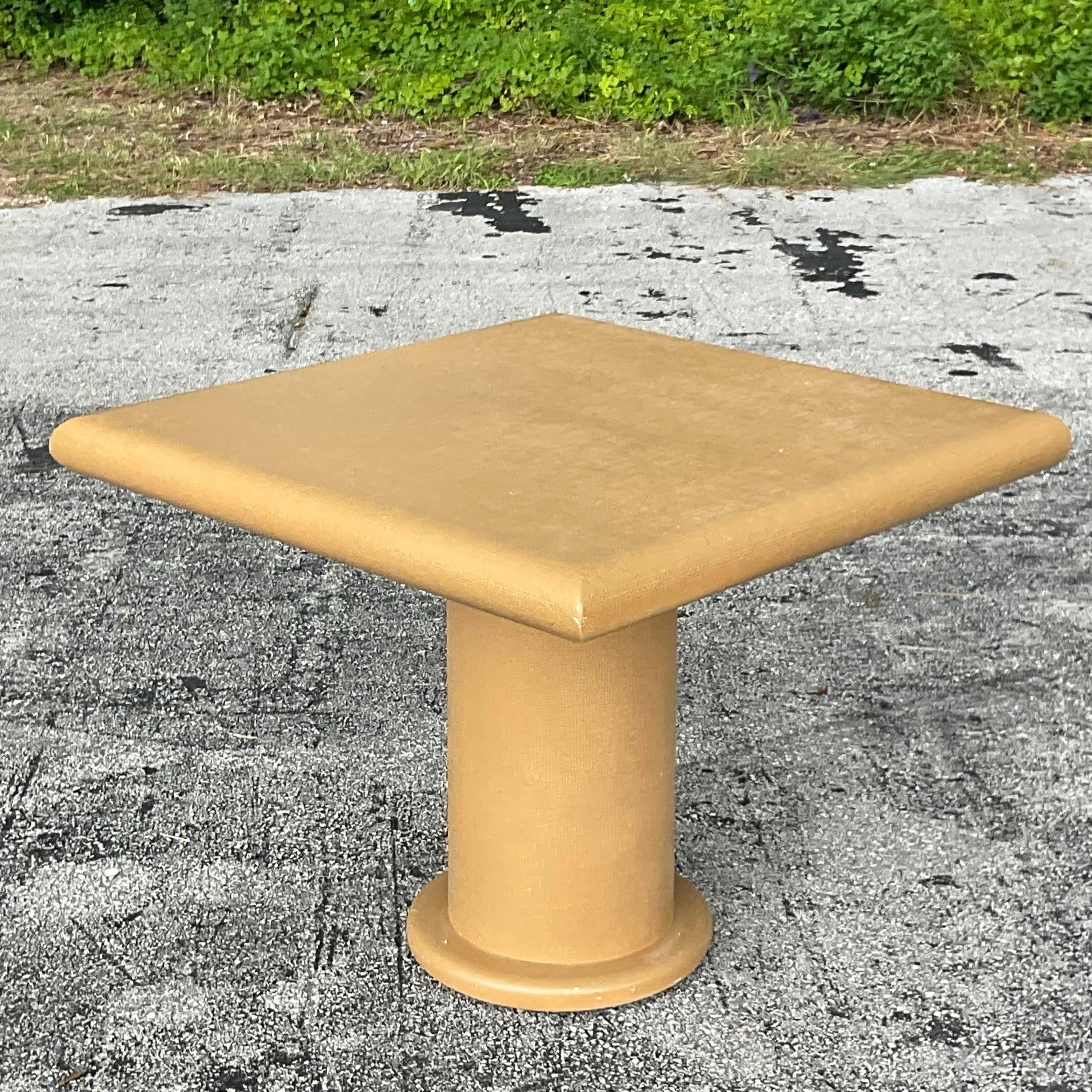 A fabulous vintage Coastal game table. A chic grass cloth finish on a chic pedestal shaped table. Bull nose edge adds to the look. Acquired from a Miami estate.