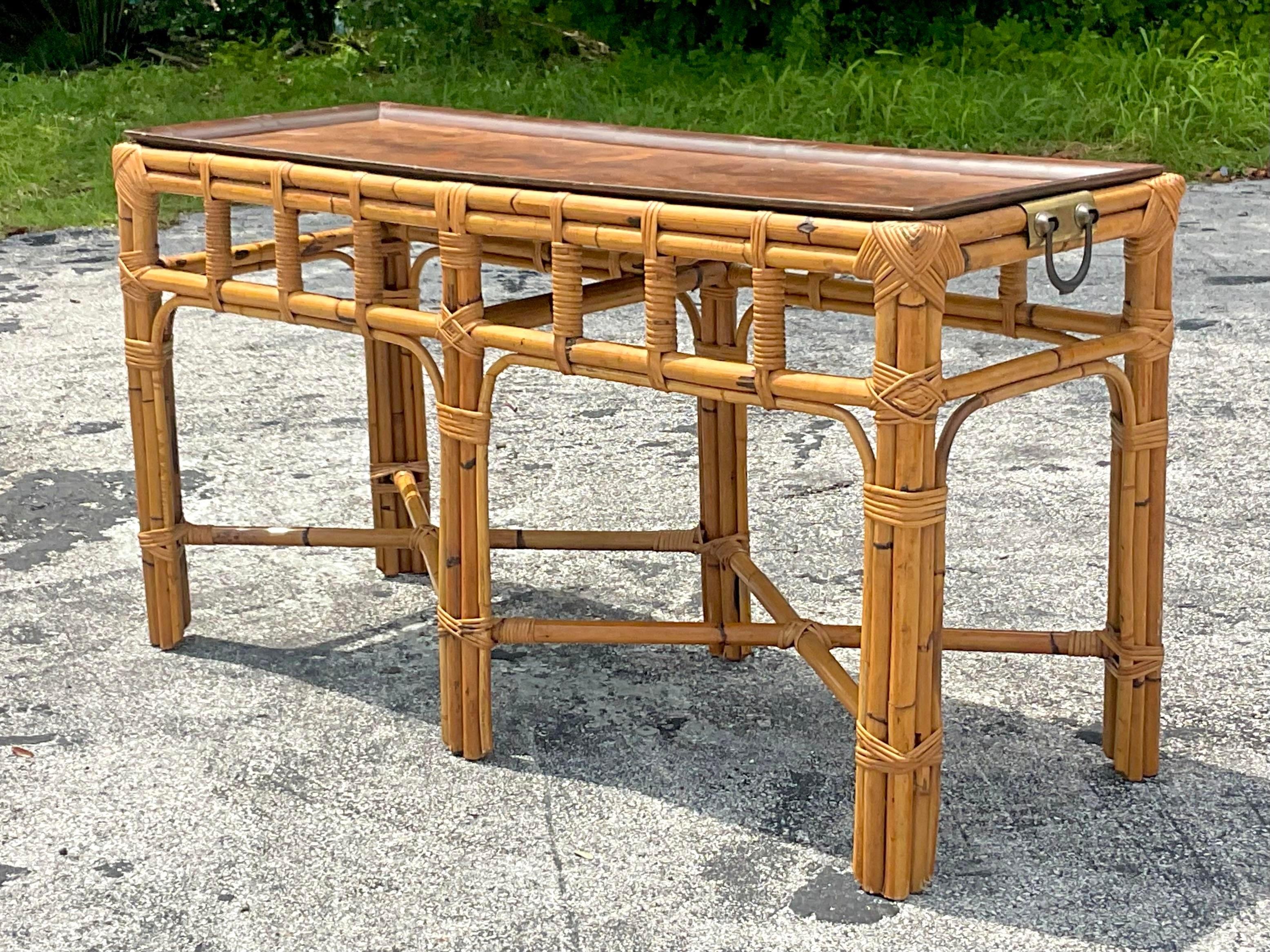 A fabulous vintage Coastal console table. Chic stacked rattan with an inlay Burl wood tray. Beautiful brass hardware on the ends. Acquired from a Miami estate.