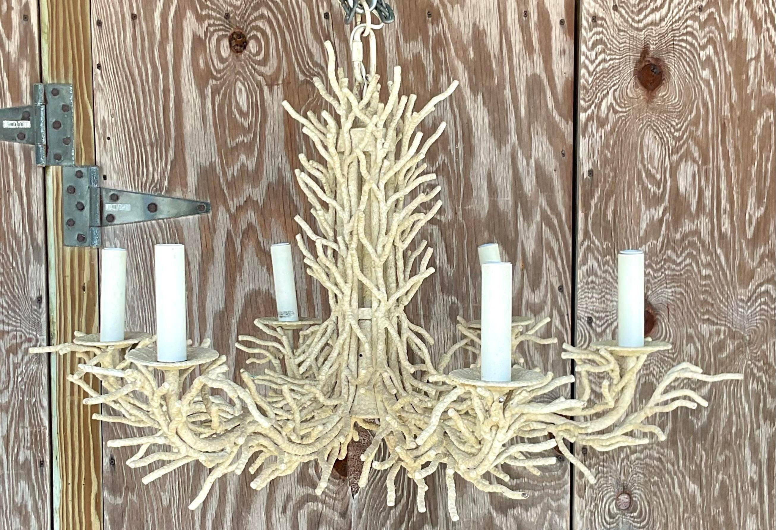 A vintage Coastal painted metal chandelier. The coveted coral brand design in a six arm design. Perfect as is or paint to match your project. Acquired from a Palm Beach estate