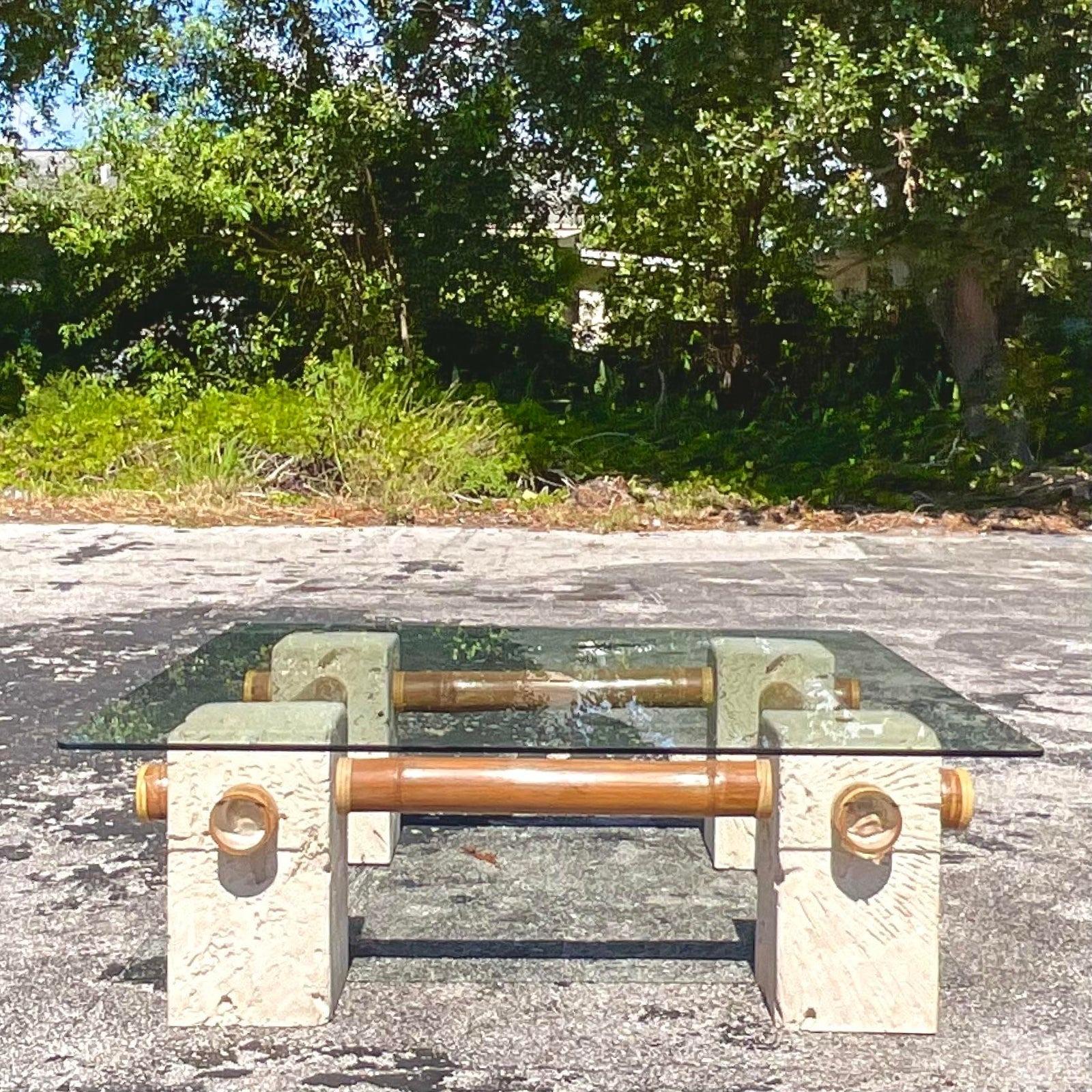 A fantastic vintage Coastal coffee table. Beautiful plaster cubes with a pressed coral design. Connected with thick bamboo rods. Glass top. Acquired from a Palm Beach estate.