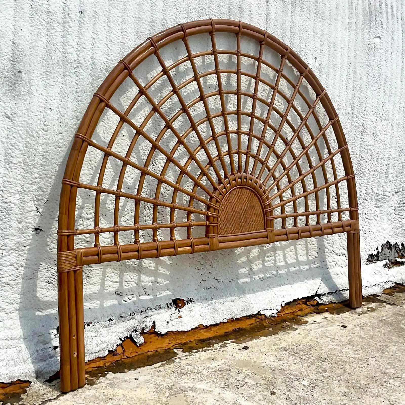 A fantastic vintage Coastal King headboard. A chic arched rattan with a grid design. A great looking headboard. Acquired from a Palm Beach estate.