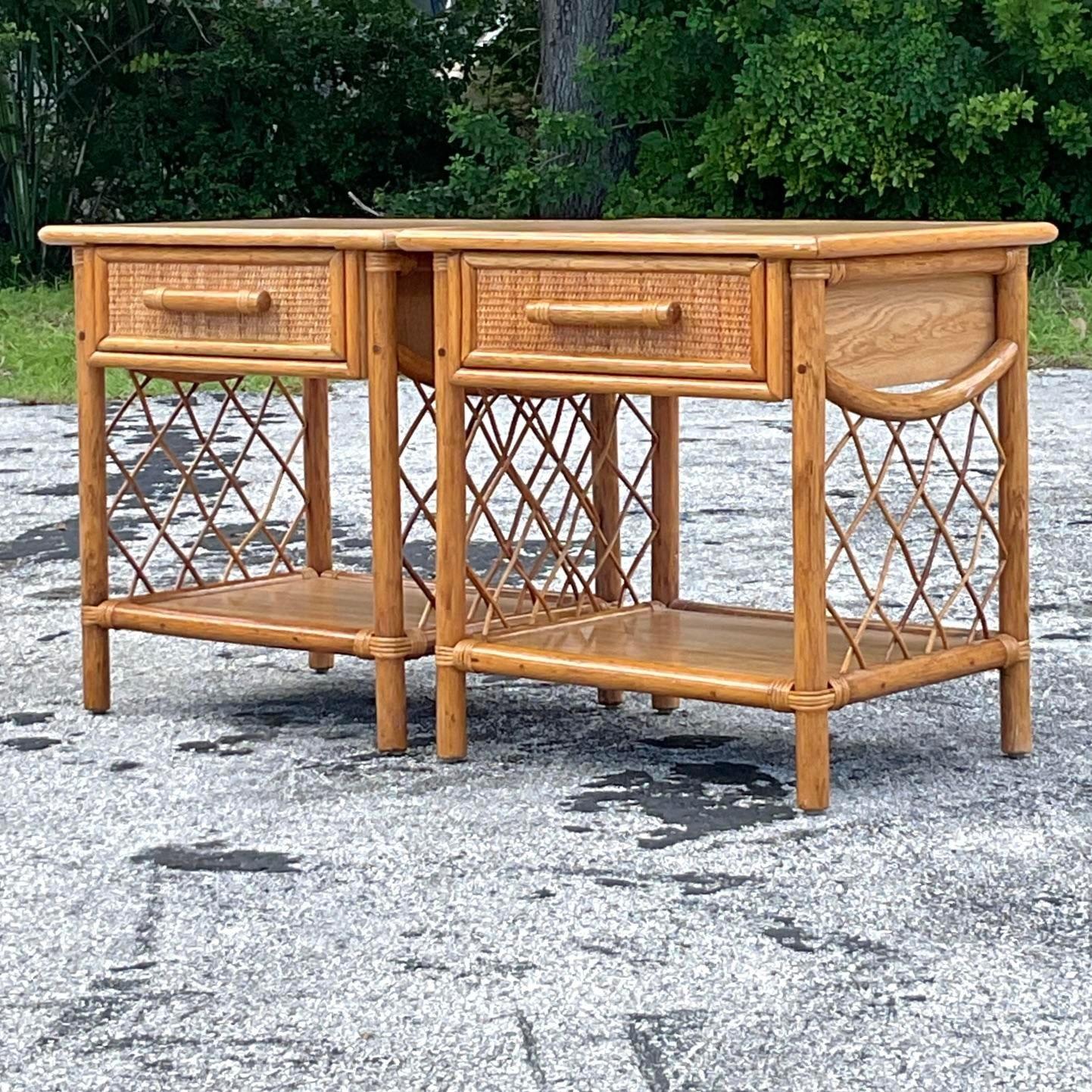 A fabulous pair of vintage Coastal nightstands. Chic frame rattan with inset woven rattan panels. Laminate surface for extra durability. Functional and good looking! Acquired from a Palm Beach estate.