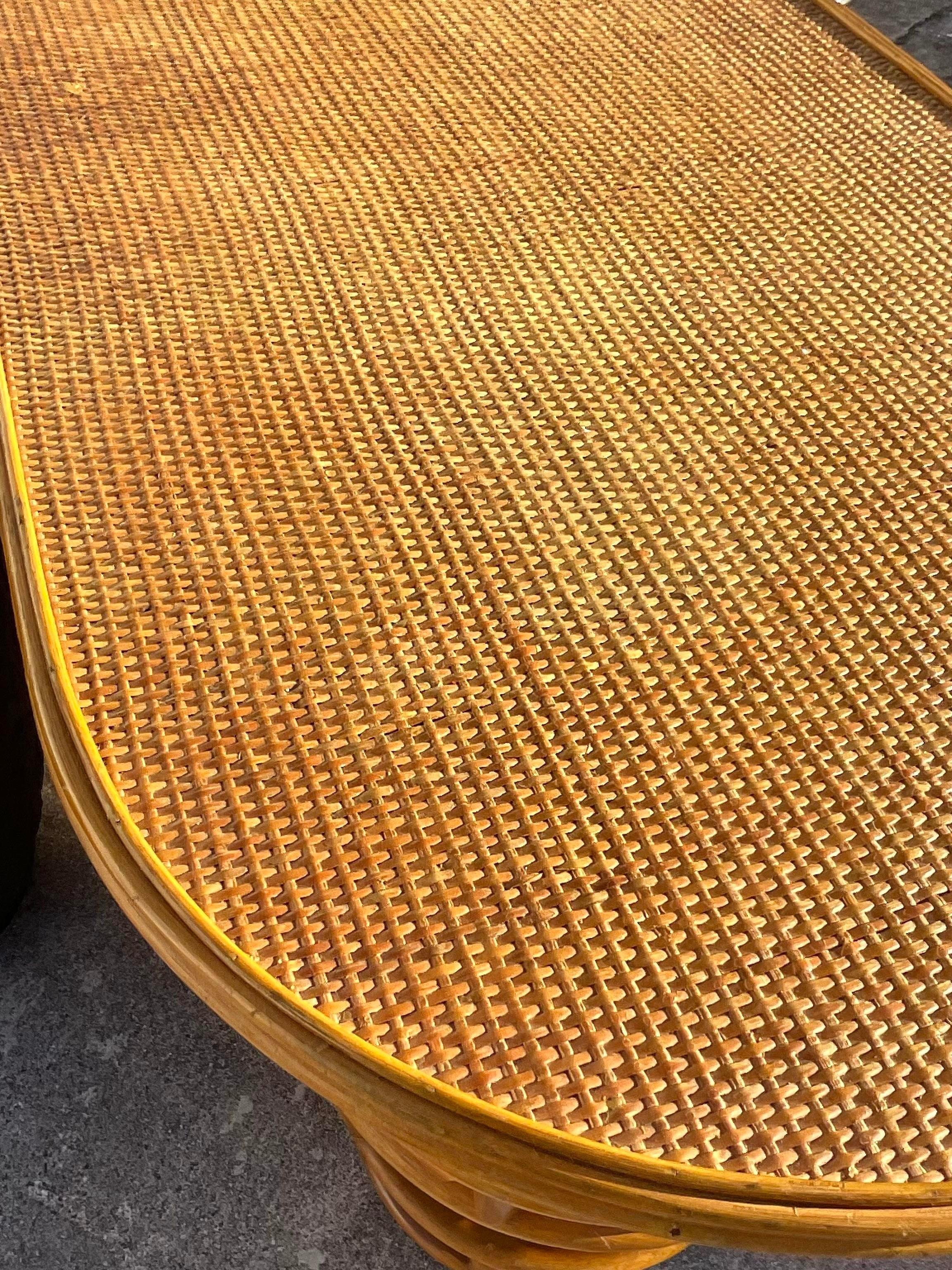 A fantastic vintage Coastal dry bar. A chic side saddle design with lots of great storage behind. Beautiful wrapped pretzel rattan and a woven rattan top. Acquired from a Palm Beach estate.