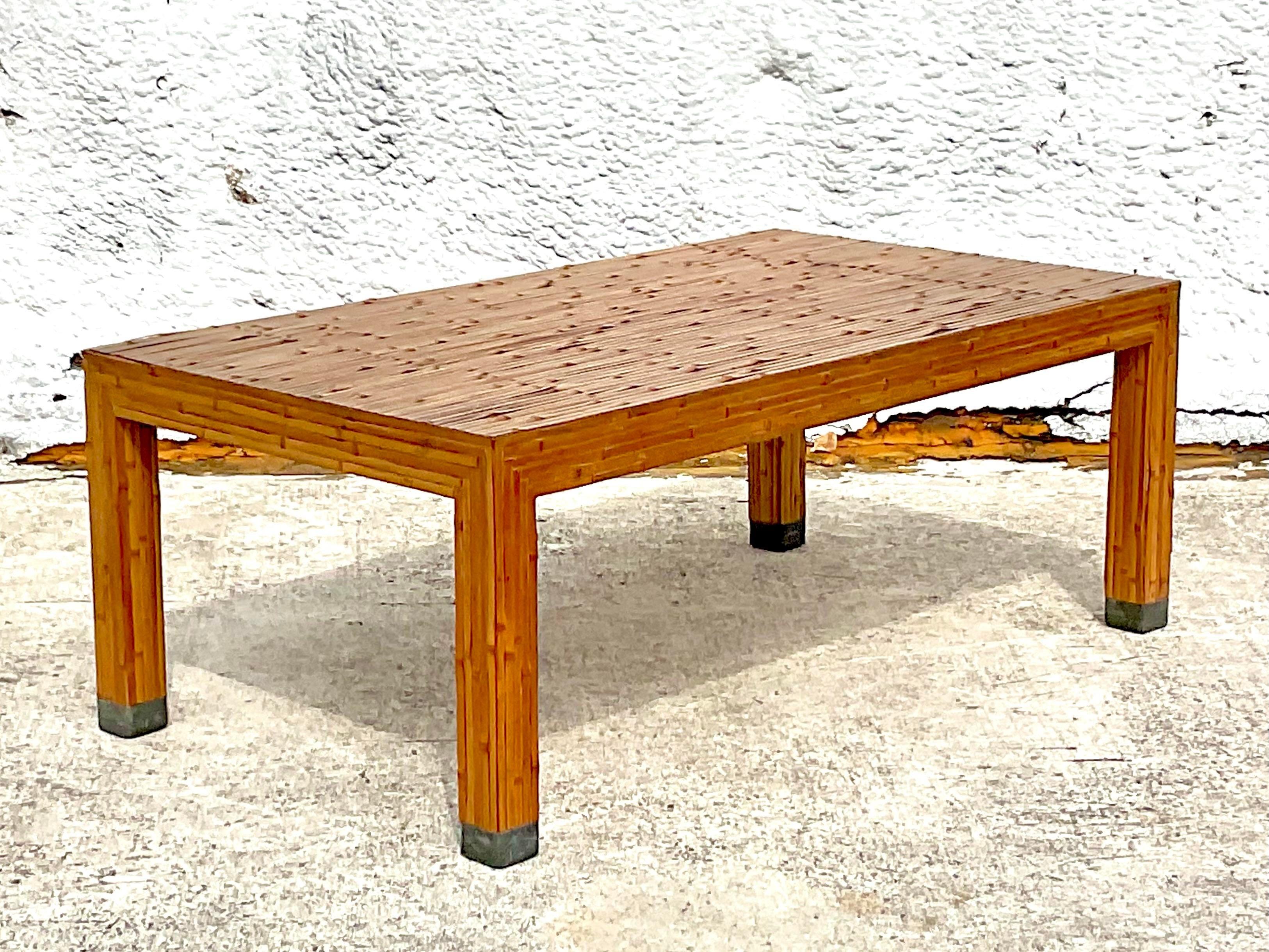 A fabulous vintage Coastal coffee table. A chic split bamboo design in a clean Parsons shape. Acquired from a Palm Beach estate.