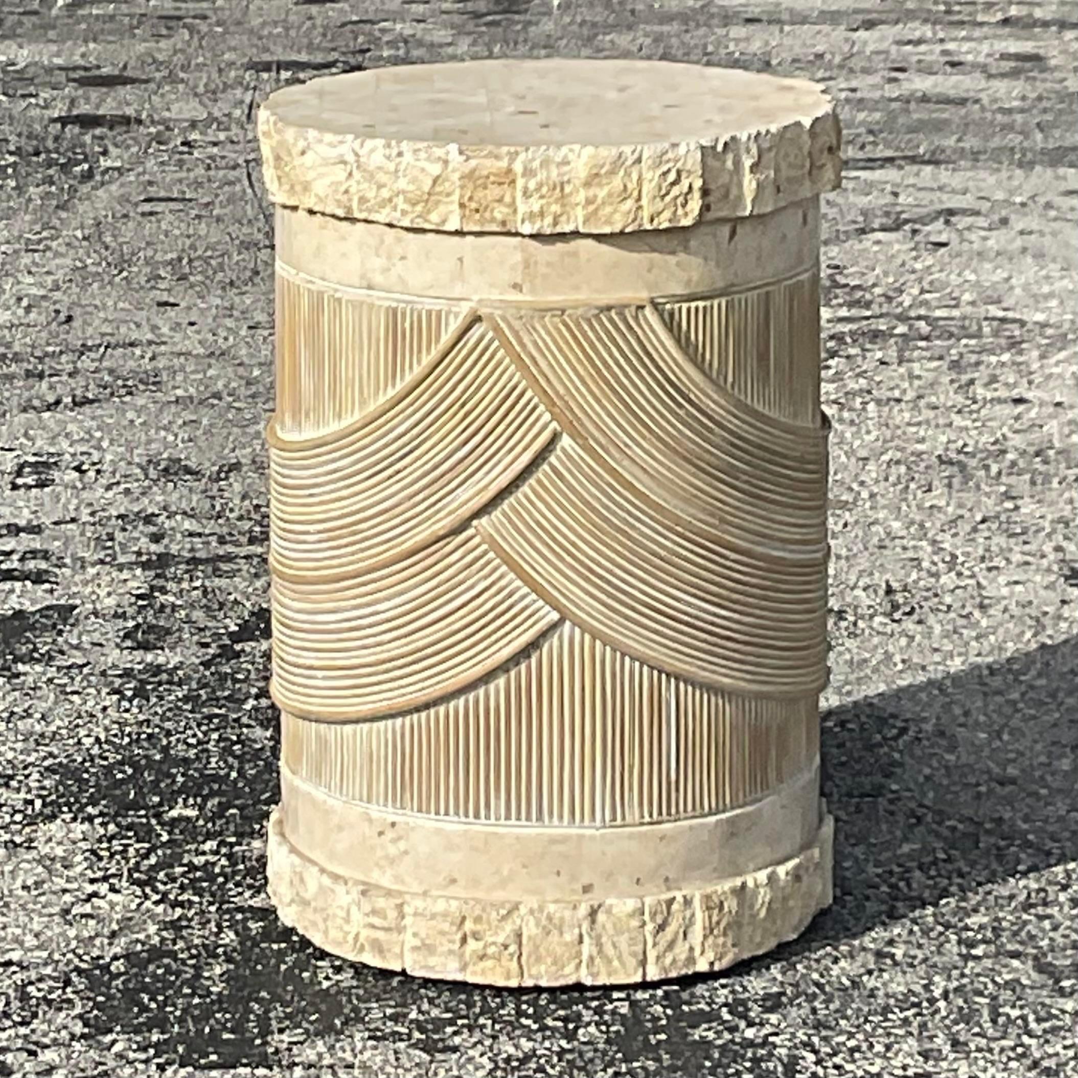 A fabulous vintage Coastal pedestal. A chic washed pencil reed with a gorgeous tessellated stone top and bottom. Perfect as a pedestal for your sculpture or orchids or even just as a little side table. You decide! Acquired from a Palm Beach estate.