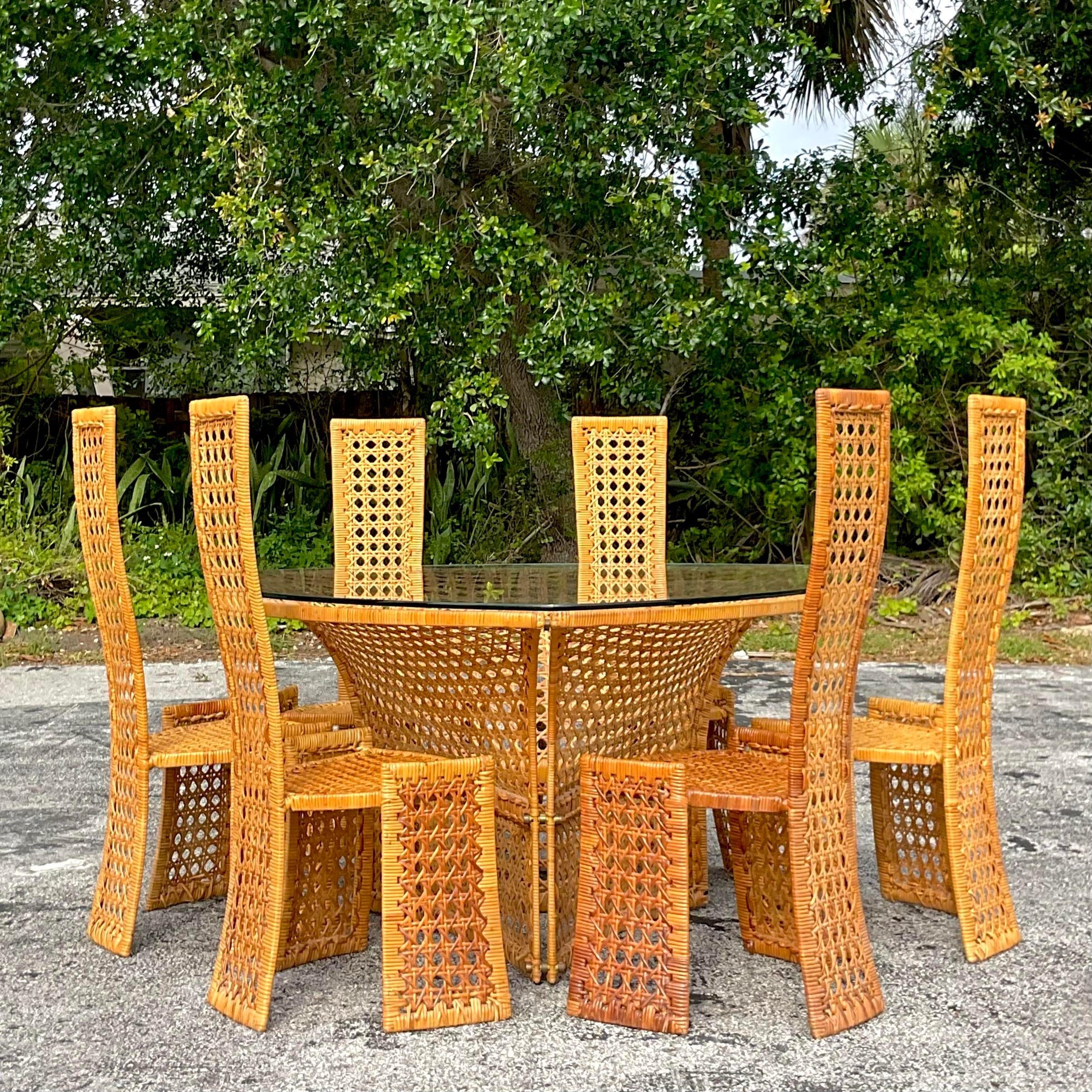 Embrace coastal allure with this vintage woven rattan dining table, echoing the enduring American style of the legendary designer Danny Ho Fong. Infuse your dining area with a blend of nostalgia and sophistication, perfect for creating cherished