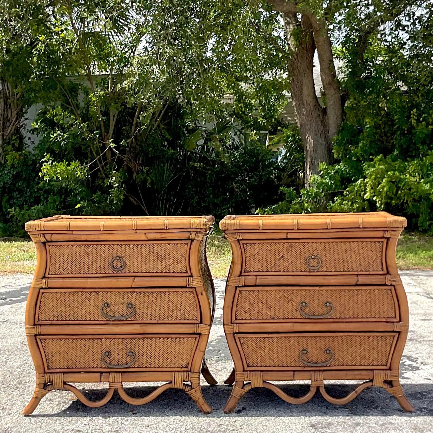 A fabulous pair of vintage Coastal nightstands. A chic woven rattan in a gorgeous wave shape. Rattan trimmed edges. Acquired from a Palm Beach estate.