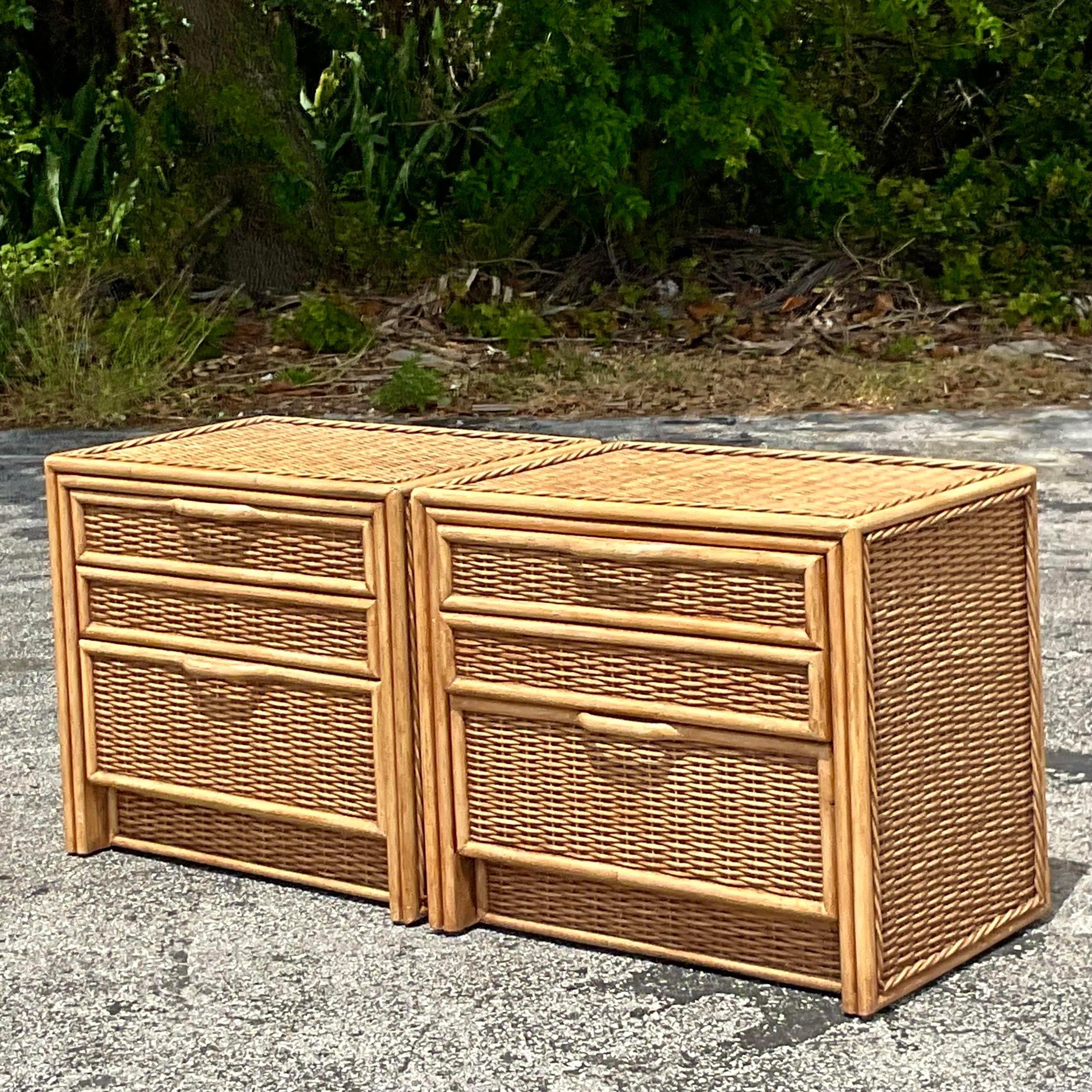 Seaside Serenity: These Vintage Coastal Woven Rattan Nightstands - A Pair, evoke the tranquil beauty of American coastal living. Crafted with meticulous weaving and timeless design, they blend natural textures with classic functionality, reflecting