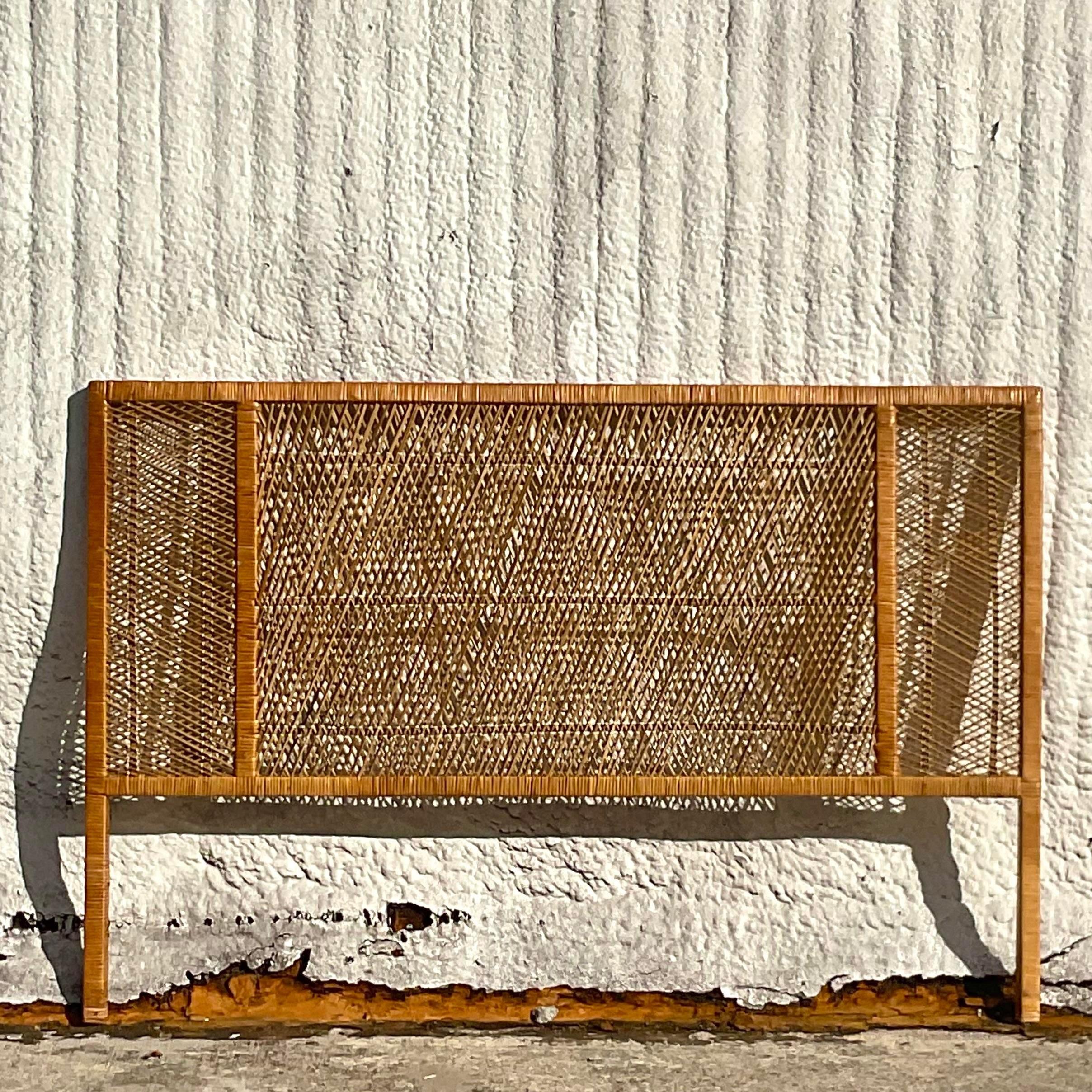 A fantastic vintage Coastal Queen headboard. Chic woven rattan in a clean and modern design. Acquired from a Palm Beach estate