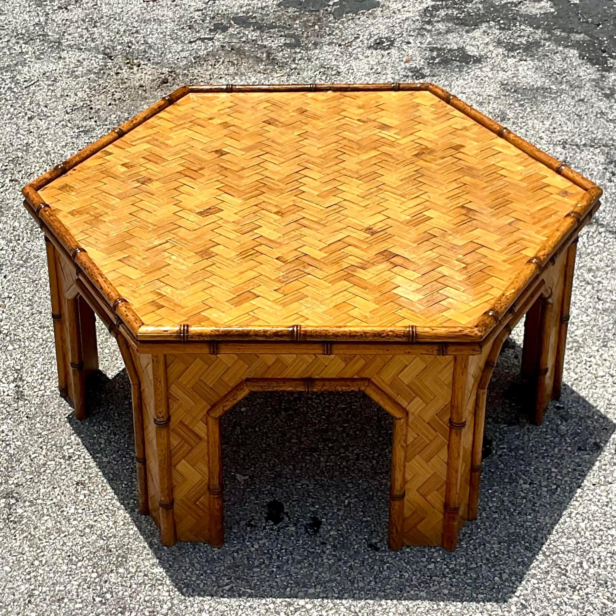A fabulous vintage Coastal coffee table. A chic Hexagon shape with parquet rattan. Beautiful bamboo trim completes the look. Acquired from a Palm Beach estate. 