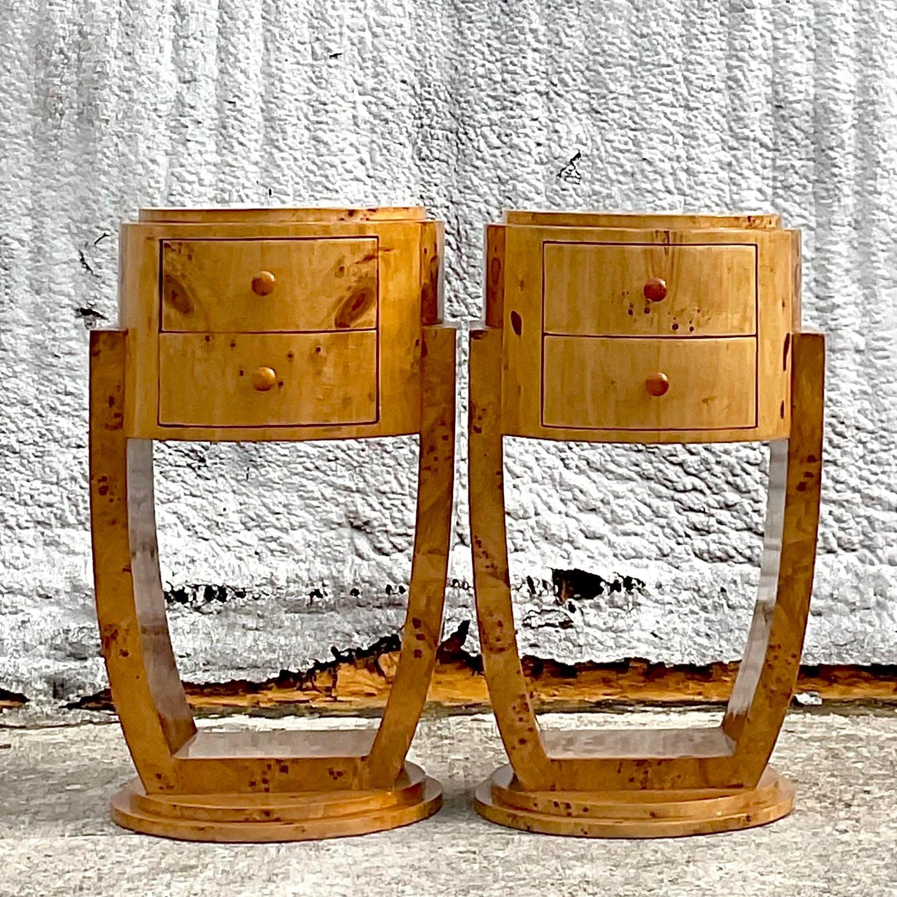 A fantastic pair of vintage Deco nightstands. A chic Burl wood construction in a glass lacquered finish. Gorgeous Bakelite pulls. Acquired from a Palm Beach estate. 