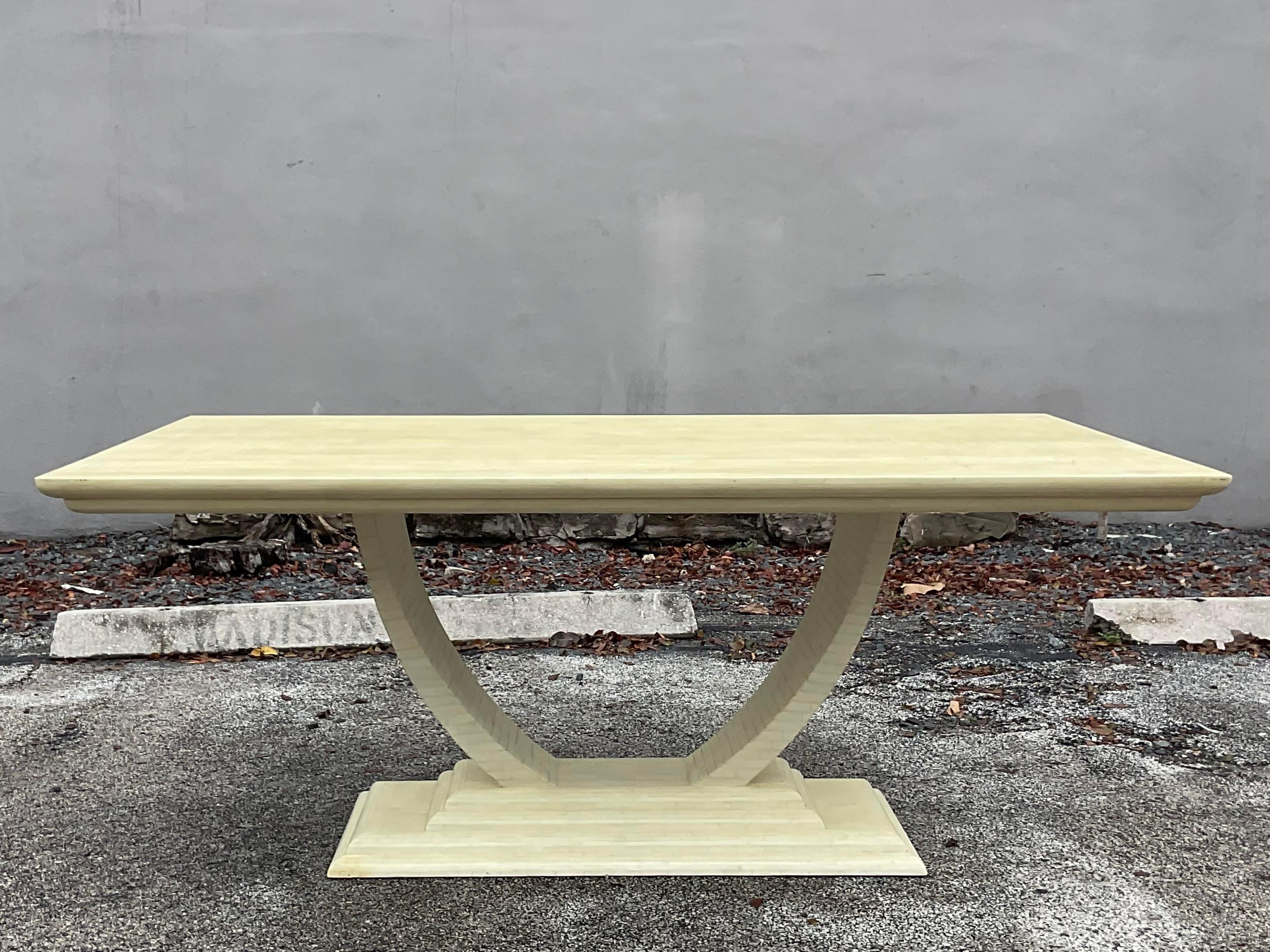 An exceptional vintage Deco dining table. Made by the iconic Jimeco group and tagged on the bottom. Chic Art Deco shape with a contemporary tessellated bone finish. Acquired from a Palm Beach estate.