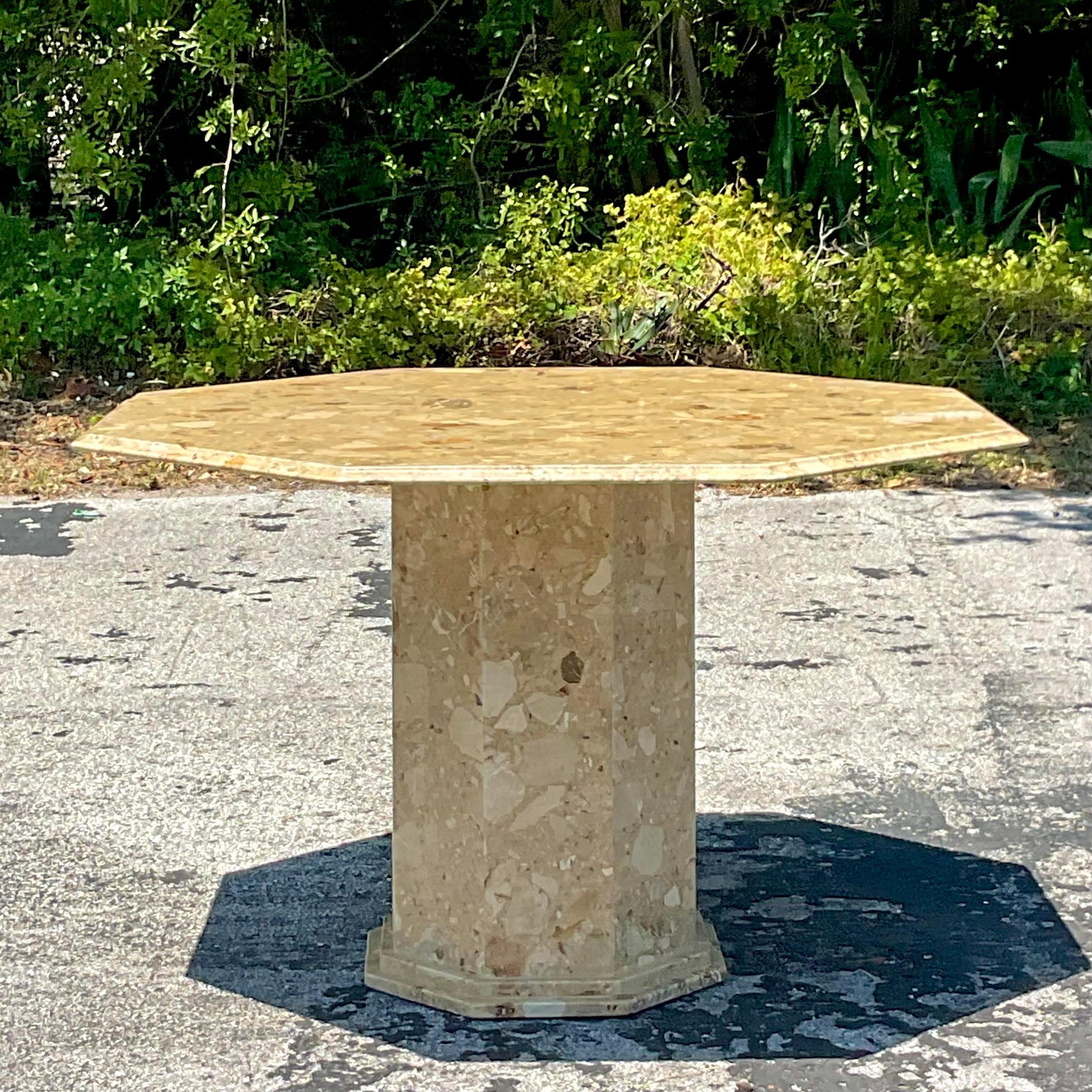 Romanesque Elegance: The Vintage Italian Octagon Stone Dining Table merges Old World grandeur with American sensibility. Crafted from exquisite stone, it becomes a centerpiece that speaks to the enduring allure of classical design while fitting
