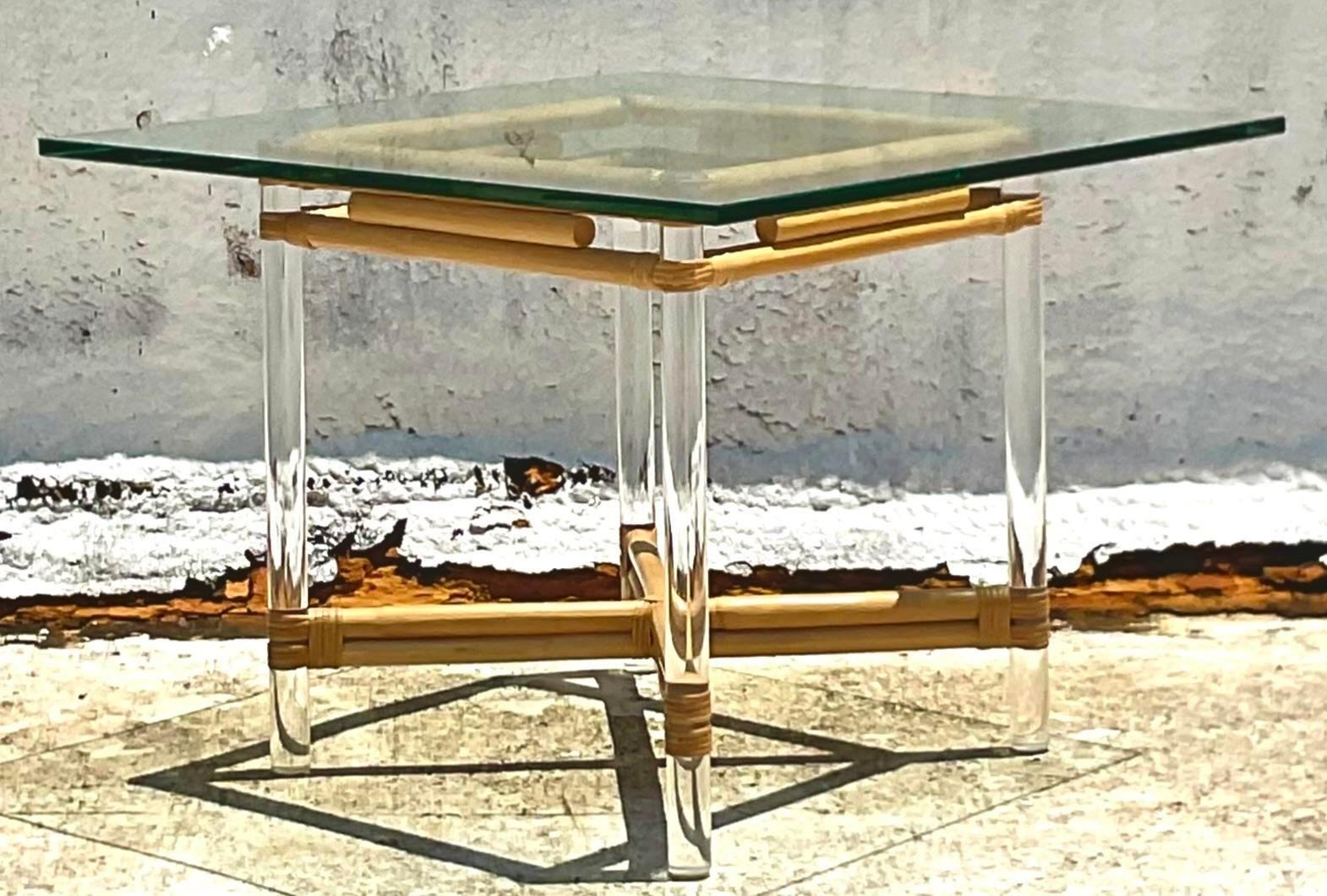 A fantastic vintage lucite and rattan game table Done in the manner of a Brown Jordan Acquired at a Palm Beach estate.