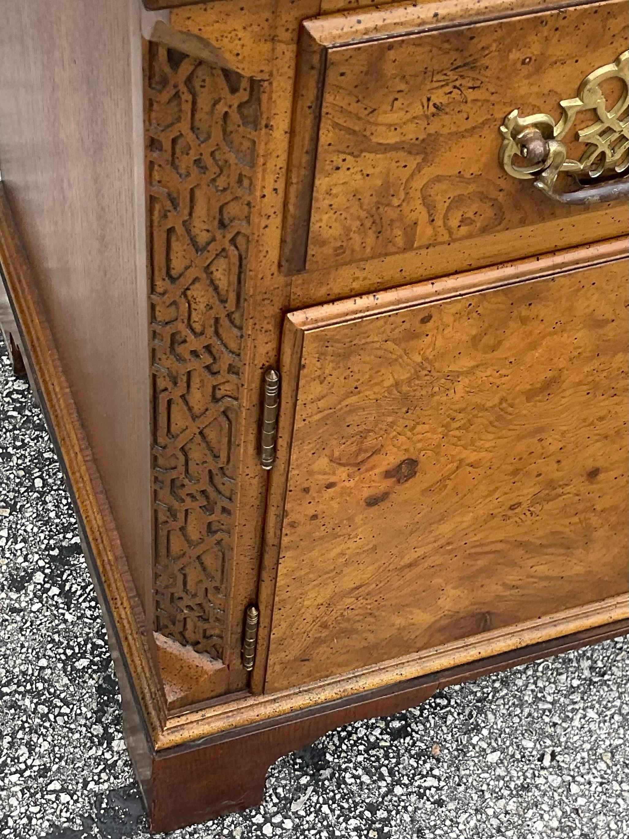 Vintage Regency tall chest of drawers. Made by the iconic Baker group and tagged inside the drawer. A chic tall shape in Burl wood with fretwork trim. Coordinating pieces also available on my page. Acquired from a Palm Beach estate.