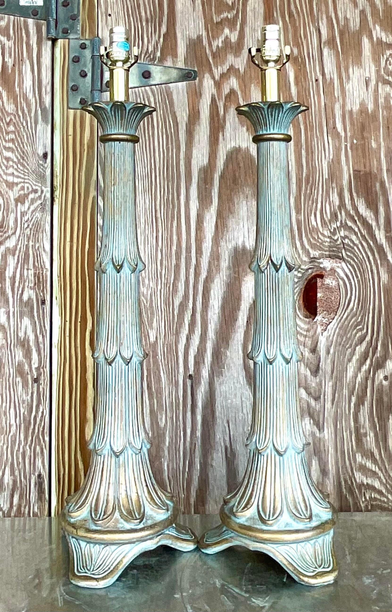 A fabulous pair of vintage Regency table lamps. A chic Italian Florentine design with a patinated bronze finish. Monumental in size and drama. Acquired from a Palm Beach estate.
