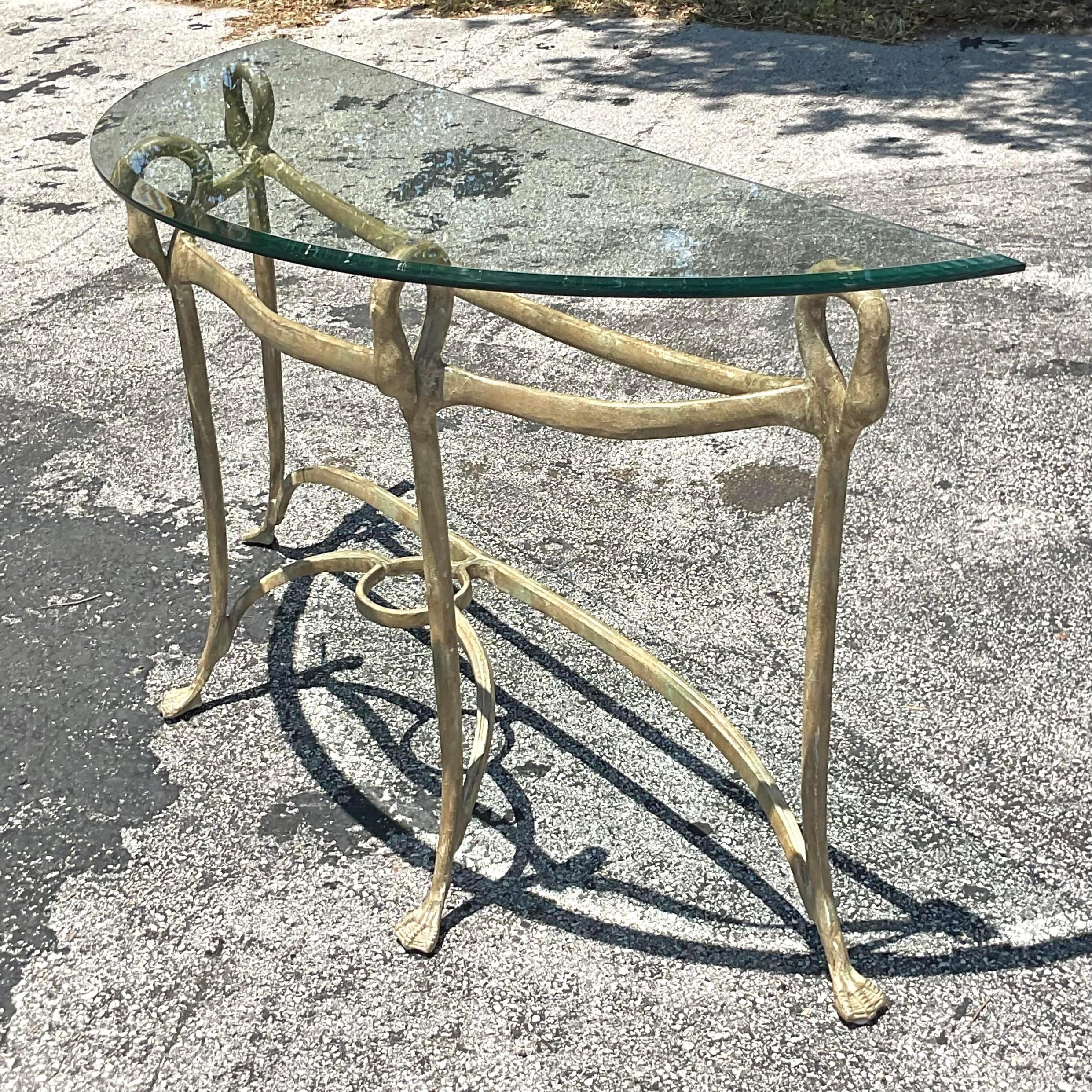 Elevate your space with the opulent charm of our Vintage Regency Gilt Swan Console Table, seamlessly blending classical elegance with American sophistication. Crafted with intricate matte gilt detailing and featuring majestic swan motifs, this table