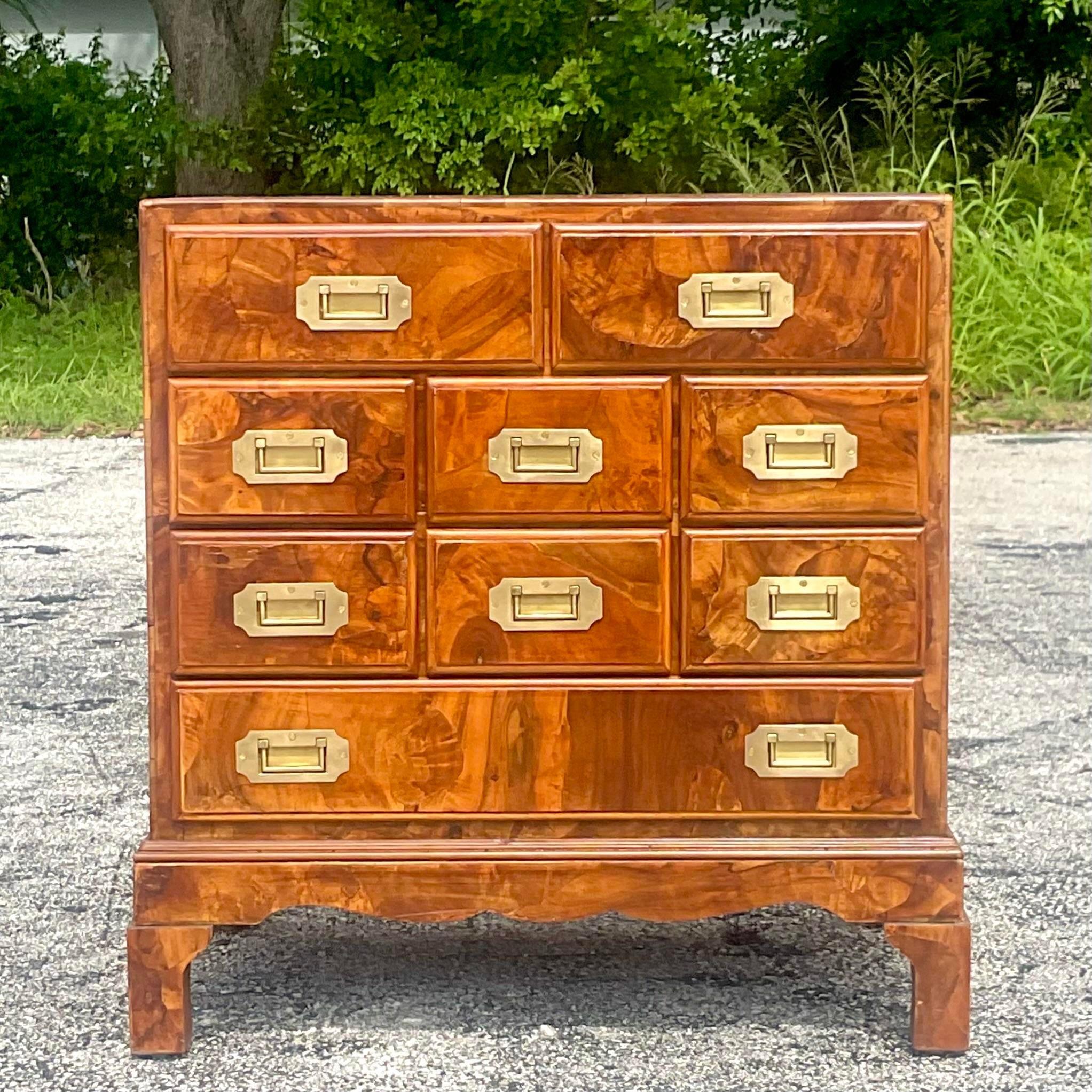 A fabulous vintage Regency petite chest of drawers. A chic patchwork Olive Burl wood with all four sides finished. Sits easily in the middle of the room. Made in Italy. Acquired from a Palm Beach estate. 