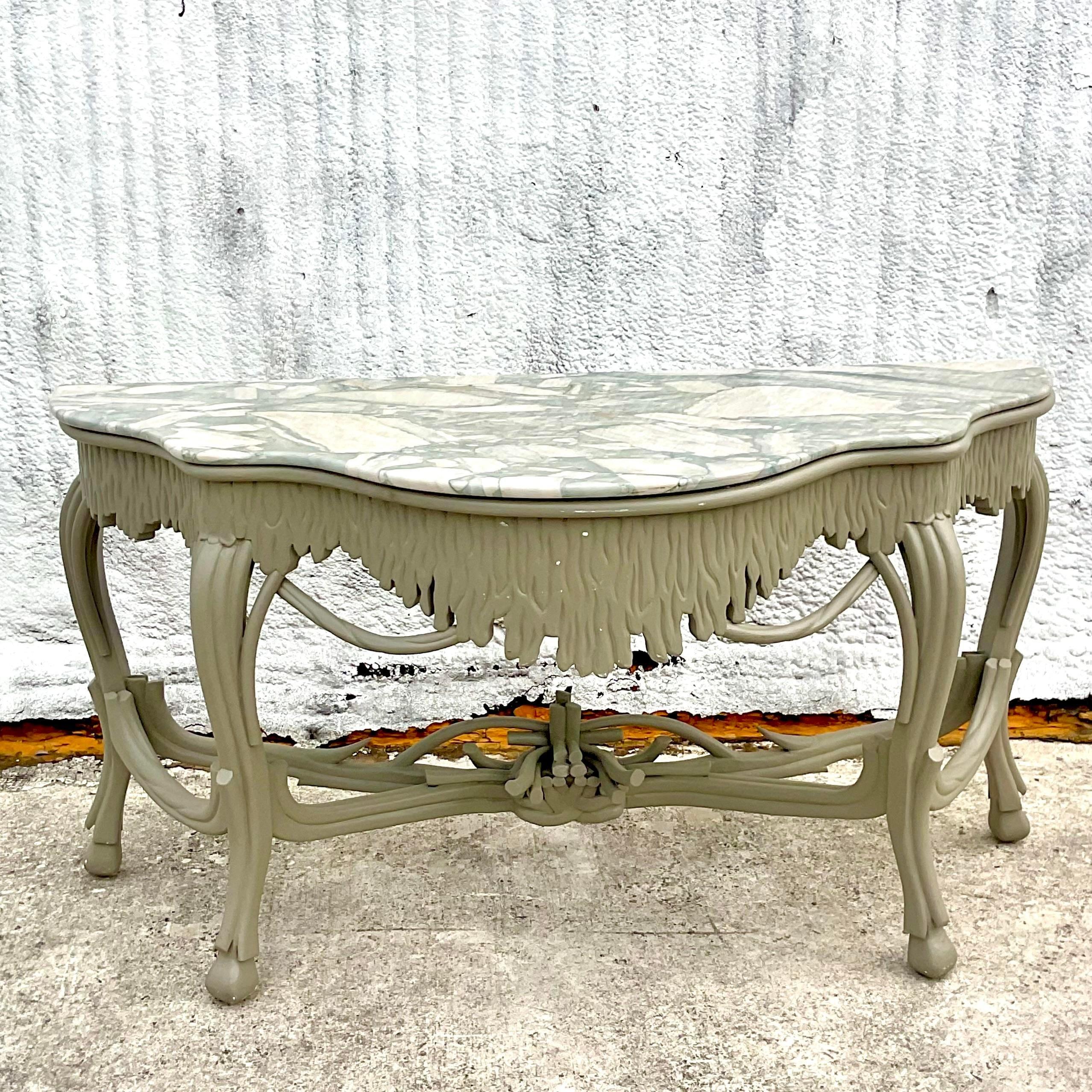 Step into timeless American elegance with our Vintage Regency Stone Top Faux Bois Console Table. Inspired by the opulence of Regency design, this table boasts a sophisticated faux bois finish and a luxurious stone top. Perfect for adding a touch of