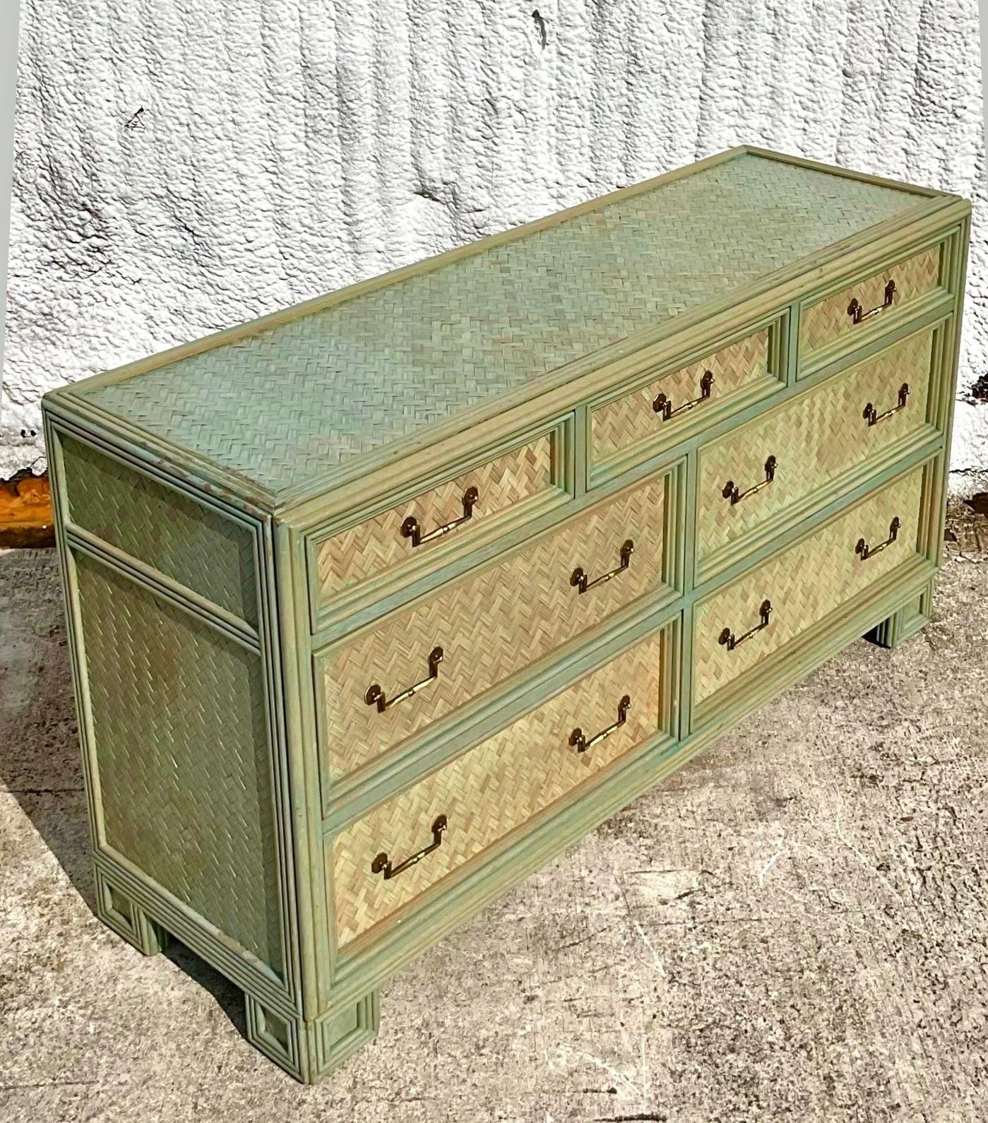 Incredible stained chevron seven drawer dresser. Gorgeous drop handle pulls. Collectible design with a fun twist in the color story almost a celadon green. More pieces from this suite are available on our page. Acquired from a Palm Beach estate.