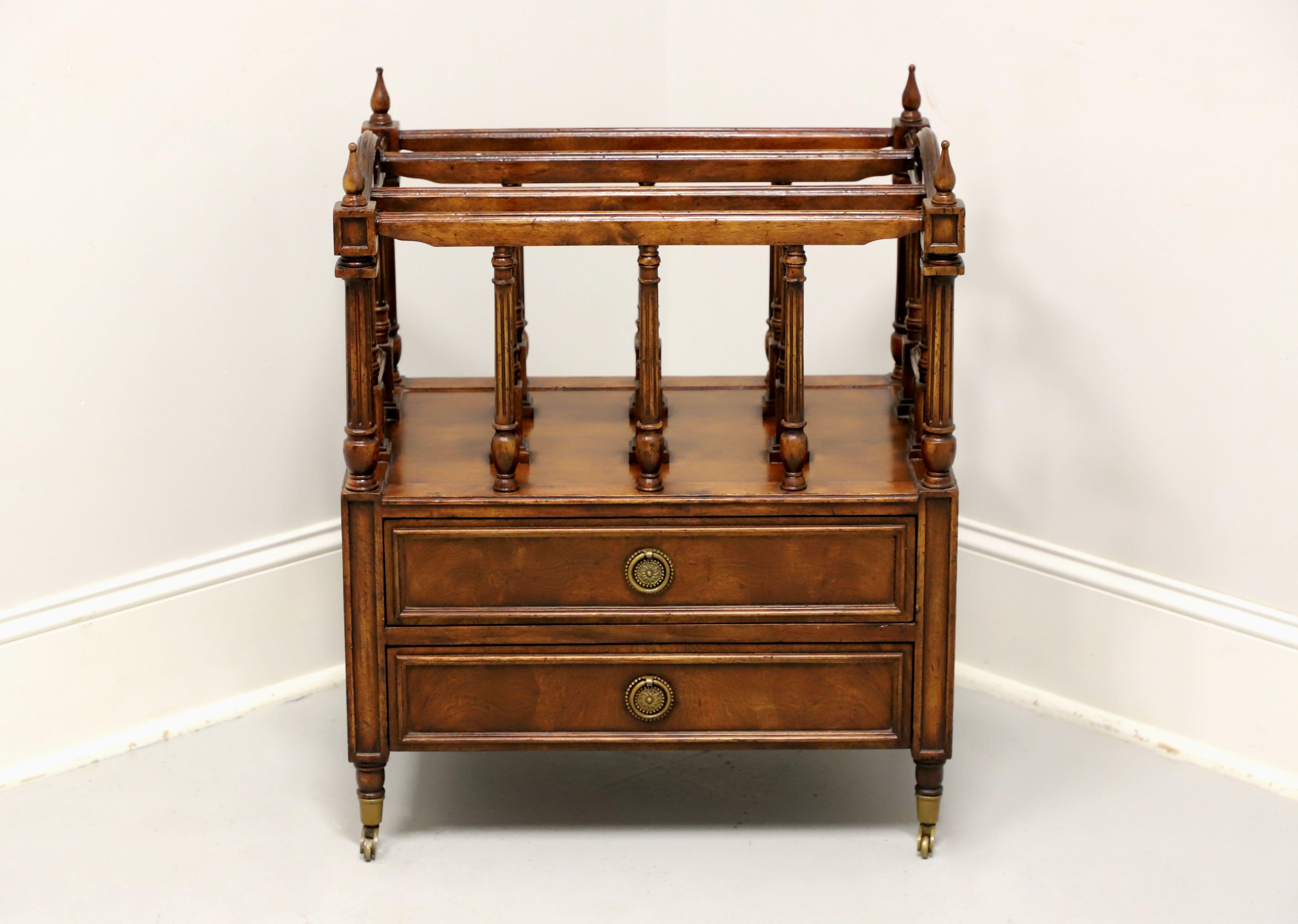 A Canterbury magazine rack in the Regency style, unbranded. Solid walnut with brass hardware, open handles, decorative turned dividers, knob finials at four corners, turned side posts, solid drawer base, and on brass casters. Features three holding