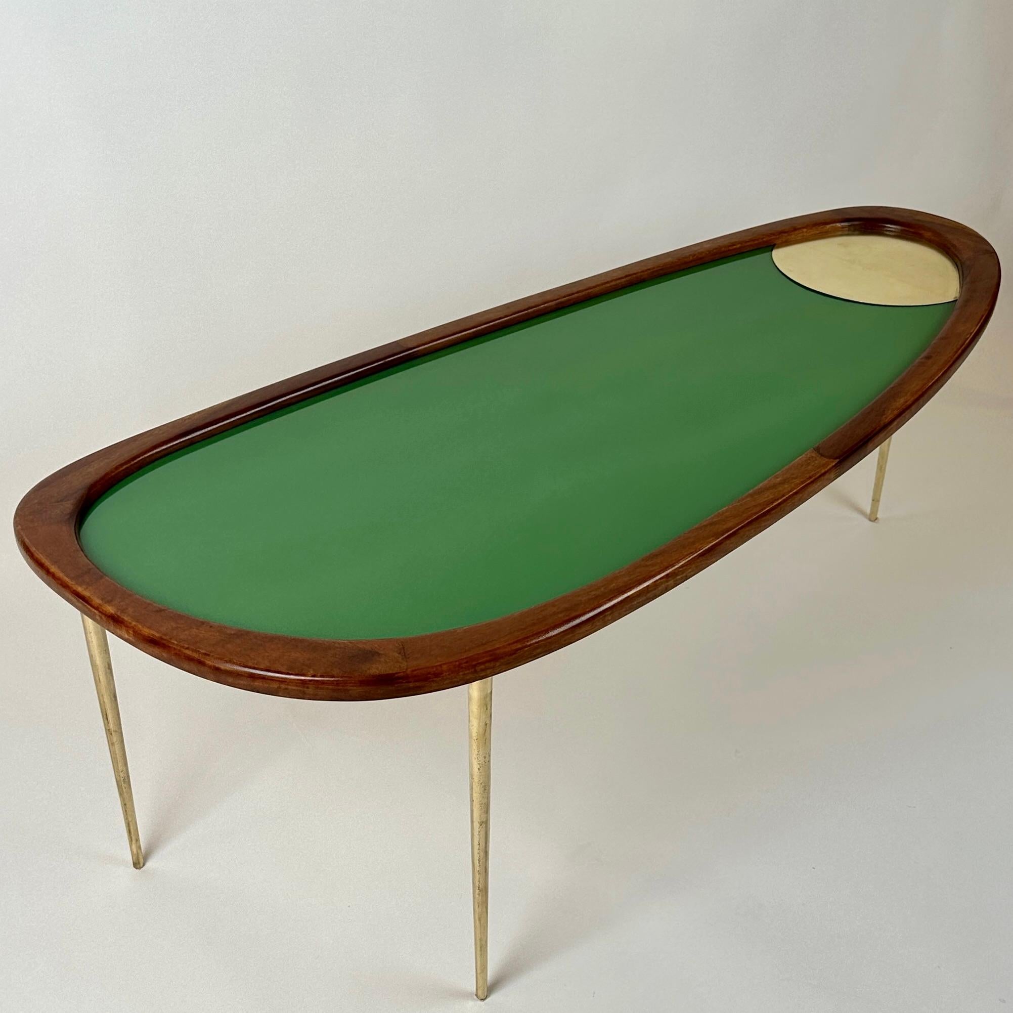 Amorphous shape coffee table made of brown ash tree wood, brass & emerald green opaline glass with brass insert. Three solid brass legs. 
This table can also be combined with another pair of side tables (like in the enclosed picture) and used as a