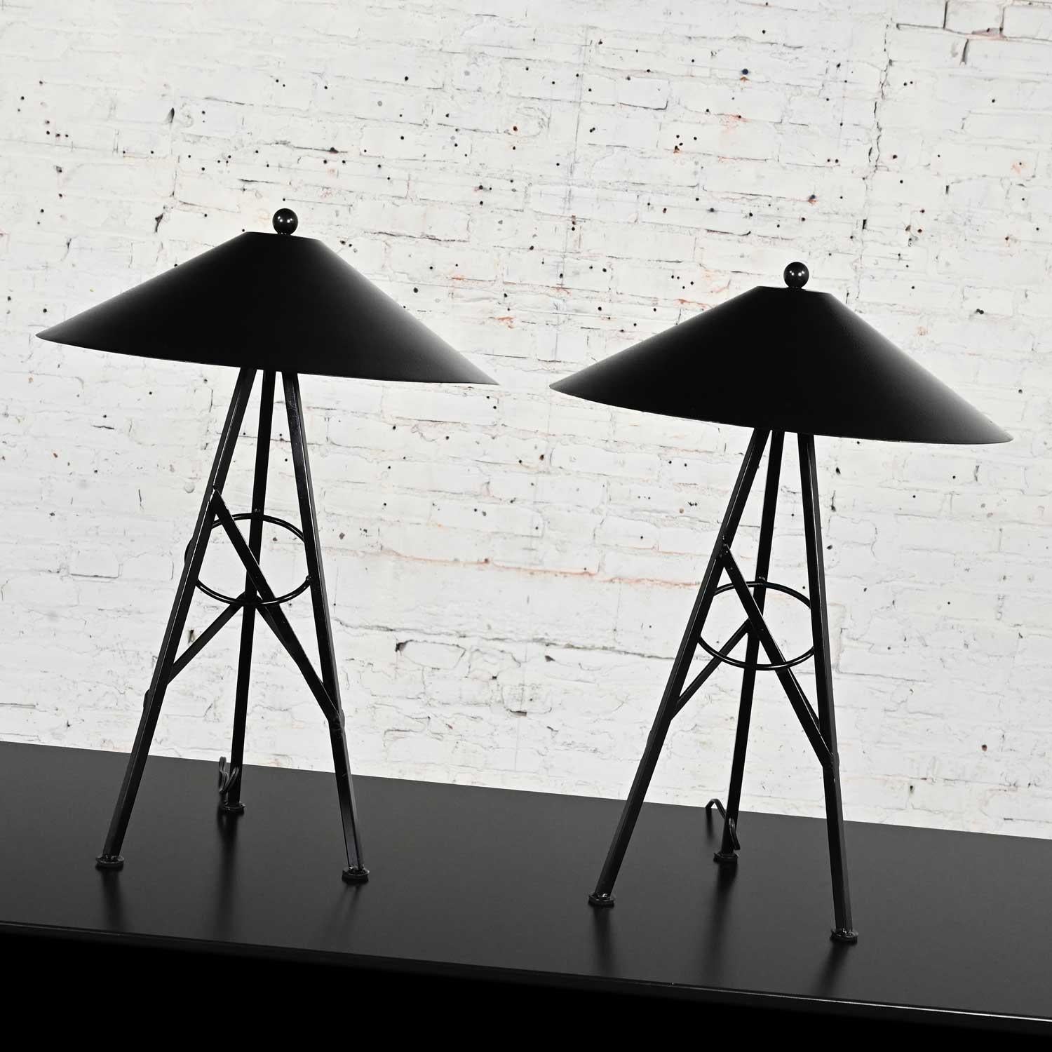 Wonderful vintage Modern to Postmodern table lamps with black painted metal tri leg bases, aluminum coolie shades with textured finish, black on outer shade and silver and black inside. These lamps are tagged made in Mexico. Beautiful condition,
