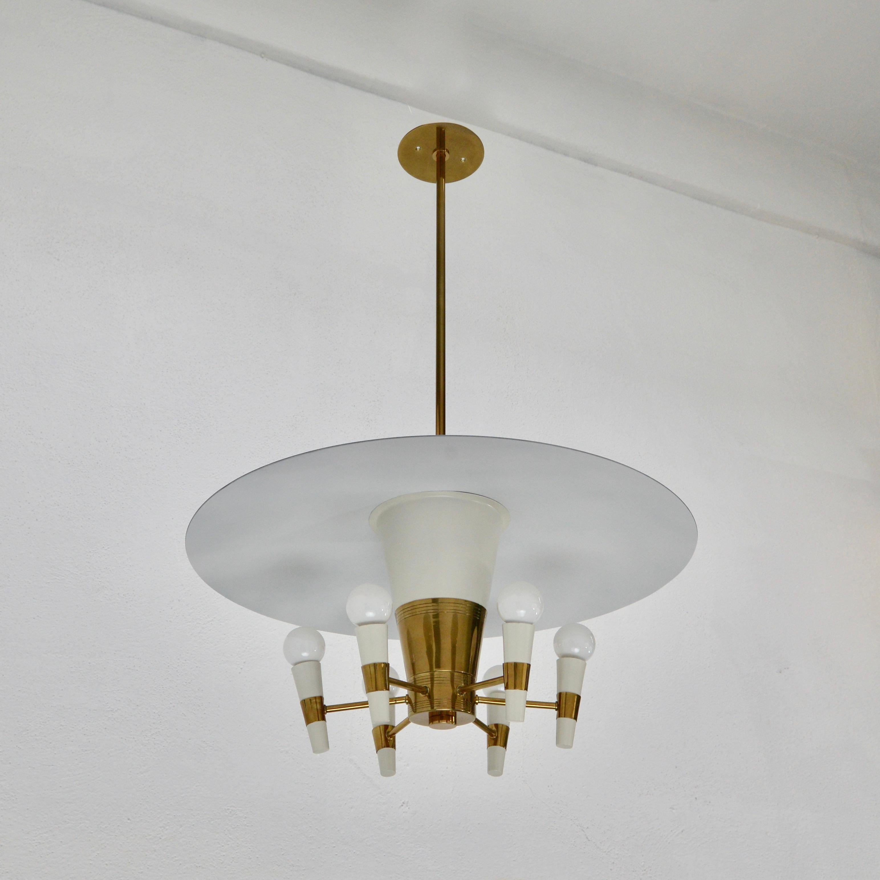 An elegant late 1940s dome pendant from Italy, Lightly patinated brass finish and painted aluminum. Wired with 6-E26 medium based sockets for use in the US. Light bulbs included with order.
Measurements:
OAD: 36” can be adjusted
Diameter:
