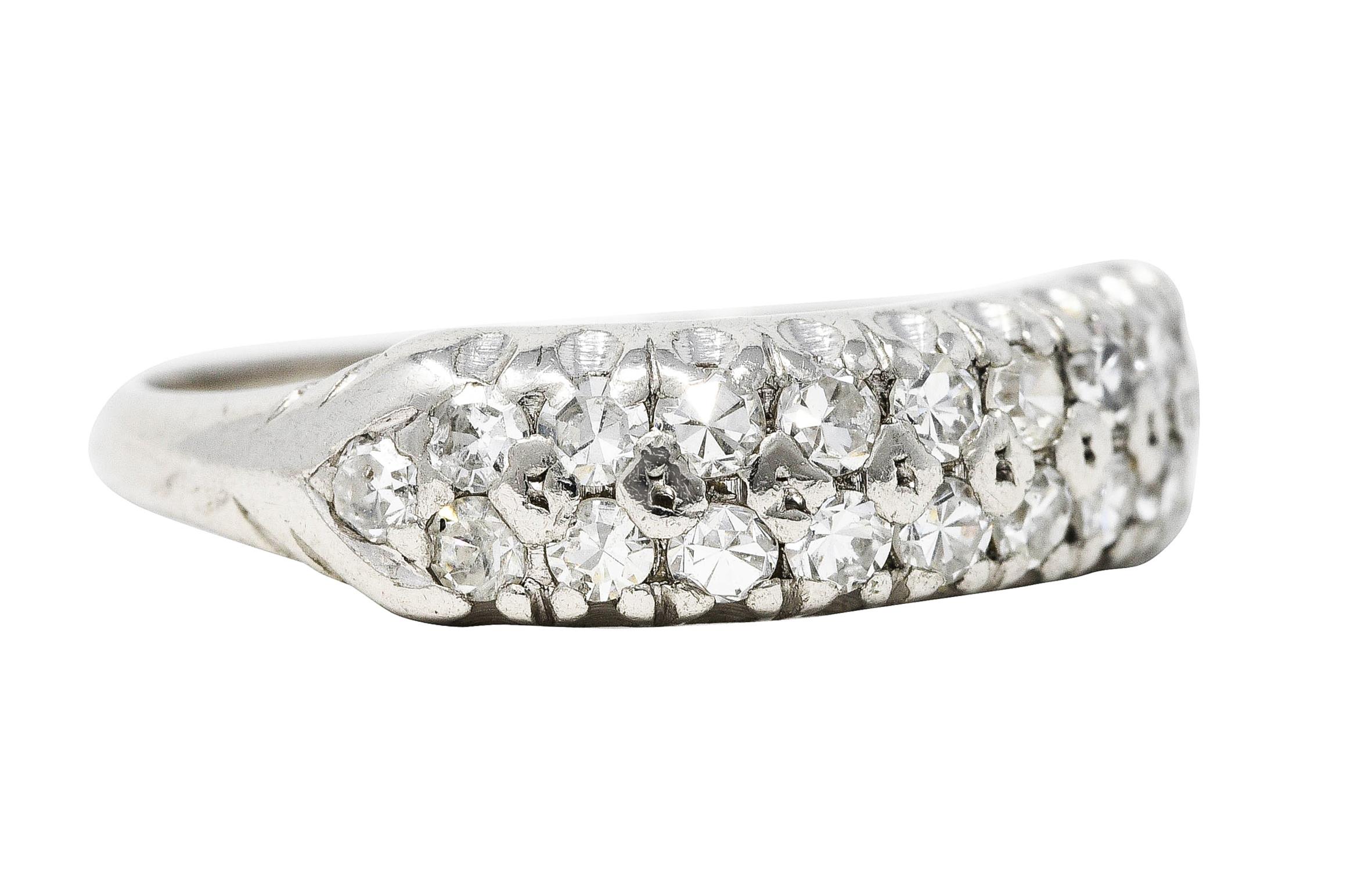Band ring is clustered East to West with single cut diamonds

Weighing in total approximately 0.50 carat with G to I color and VS to SI clarity

Terminating as pointed shoulders with a fishtail gallery

Stamped for platinum

Circa: 1930s

Ring Size: